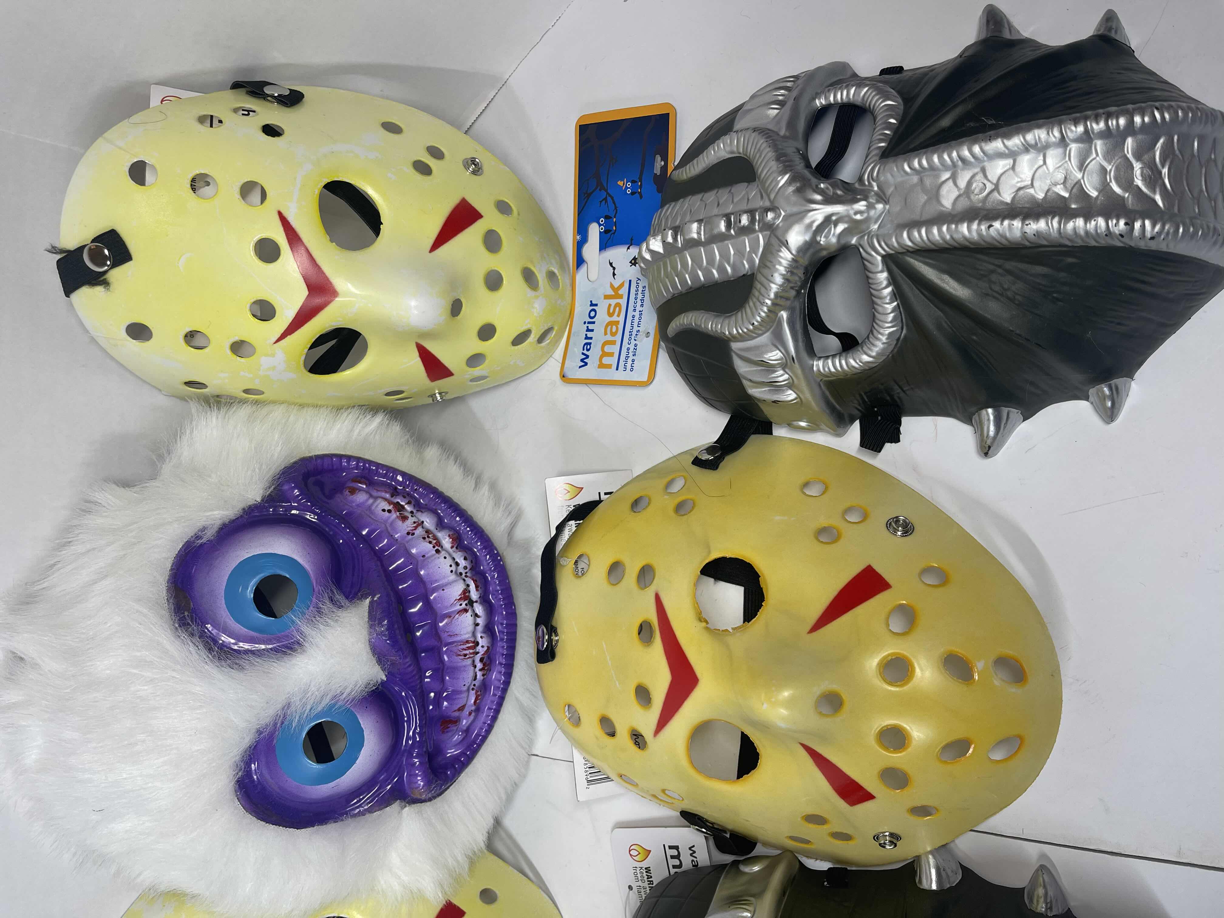 Photo 4 of HALLOWEEN PLASTIC MASKS (8) ONE SIZE FITS MOST ADULTS