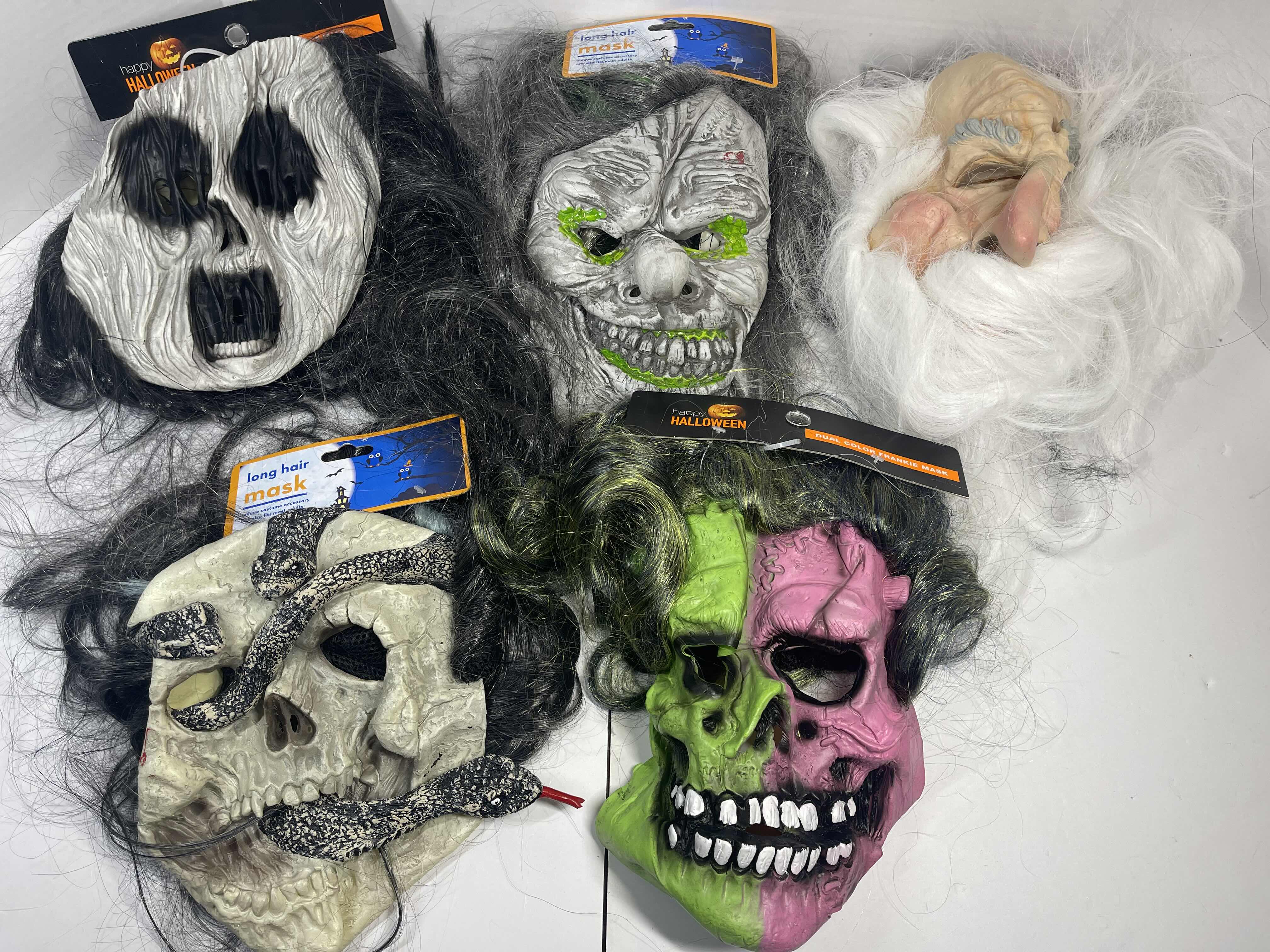 Photo 1 of HALLOWEEN RUBBER MASKS WITH HAIR (5) ONE SIZE FITS MOST ADULTS MSRP $80