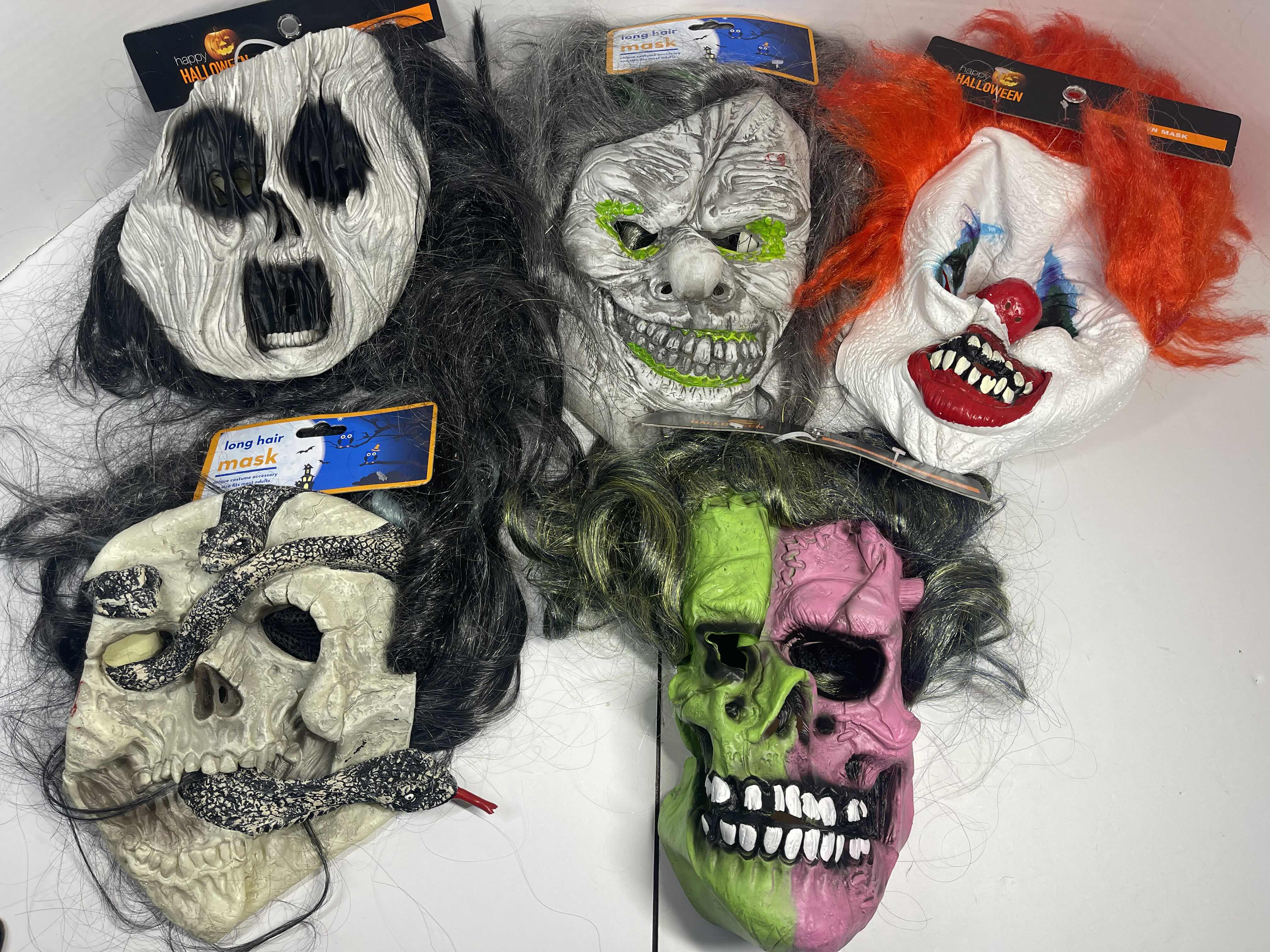 Photo 1 of HALLOWEEN RUBBER MASKS WITH HAIR (5) ONE SIZE FITS MOST ADULTS MSRP $80