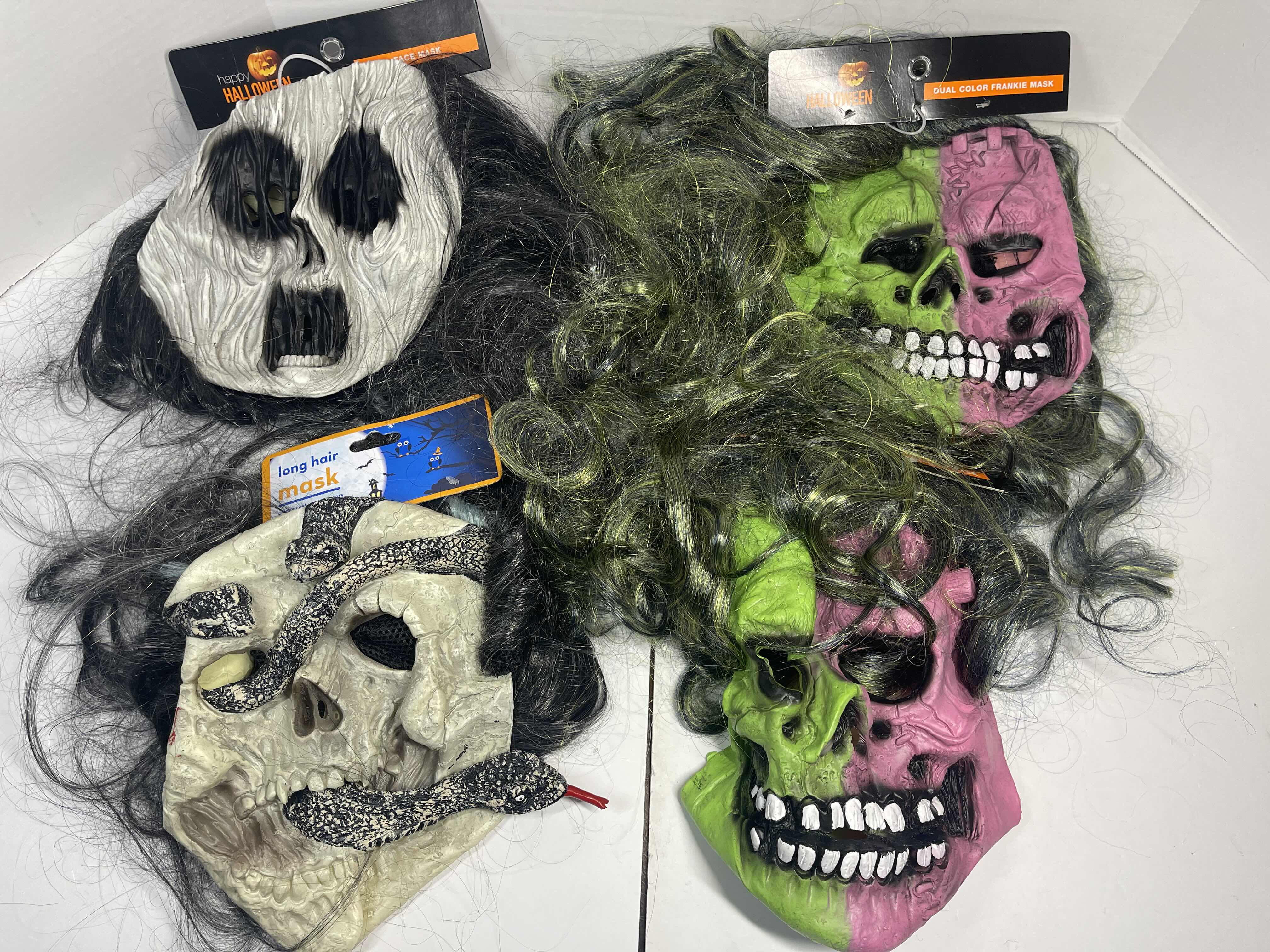 Photo 1 of HALLOWEEN RUBBER MASKS WITH HAIR (4) ONE SIZE FITS MOST ADULTS MSRP $65