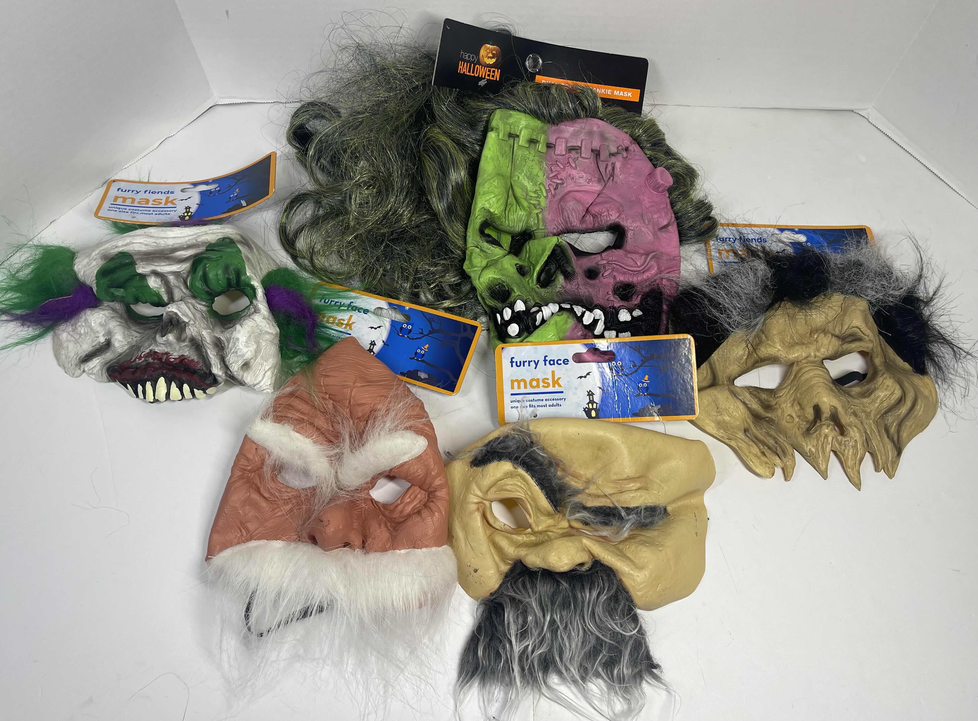 Photo 1 of HALLOWEEN RUBBER MASKS WITH HAIR (5) ONE SIZE FITS MOST ADULTS MSRP $65