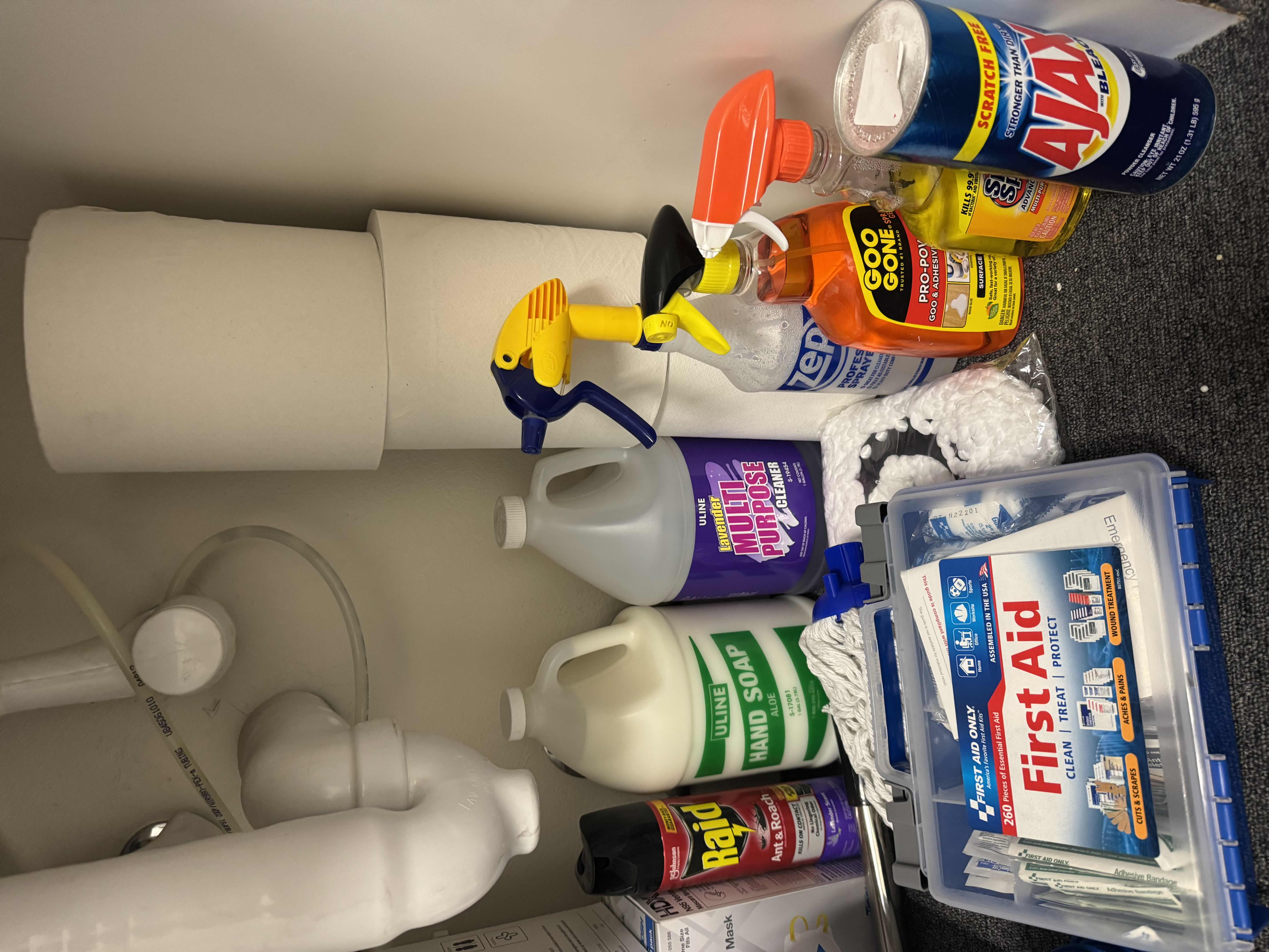 Photo 1 of CONTENTS OF CABINET- INDUSTRIAL CLEANING SUPPLIES W FIRST AID