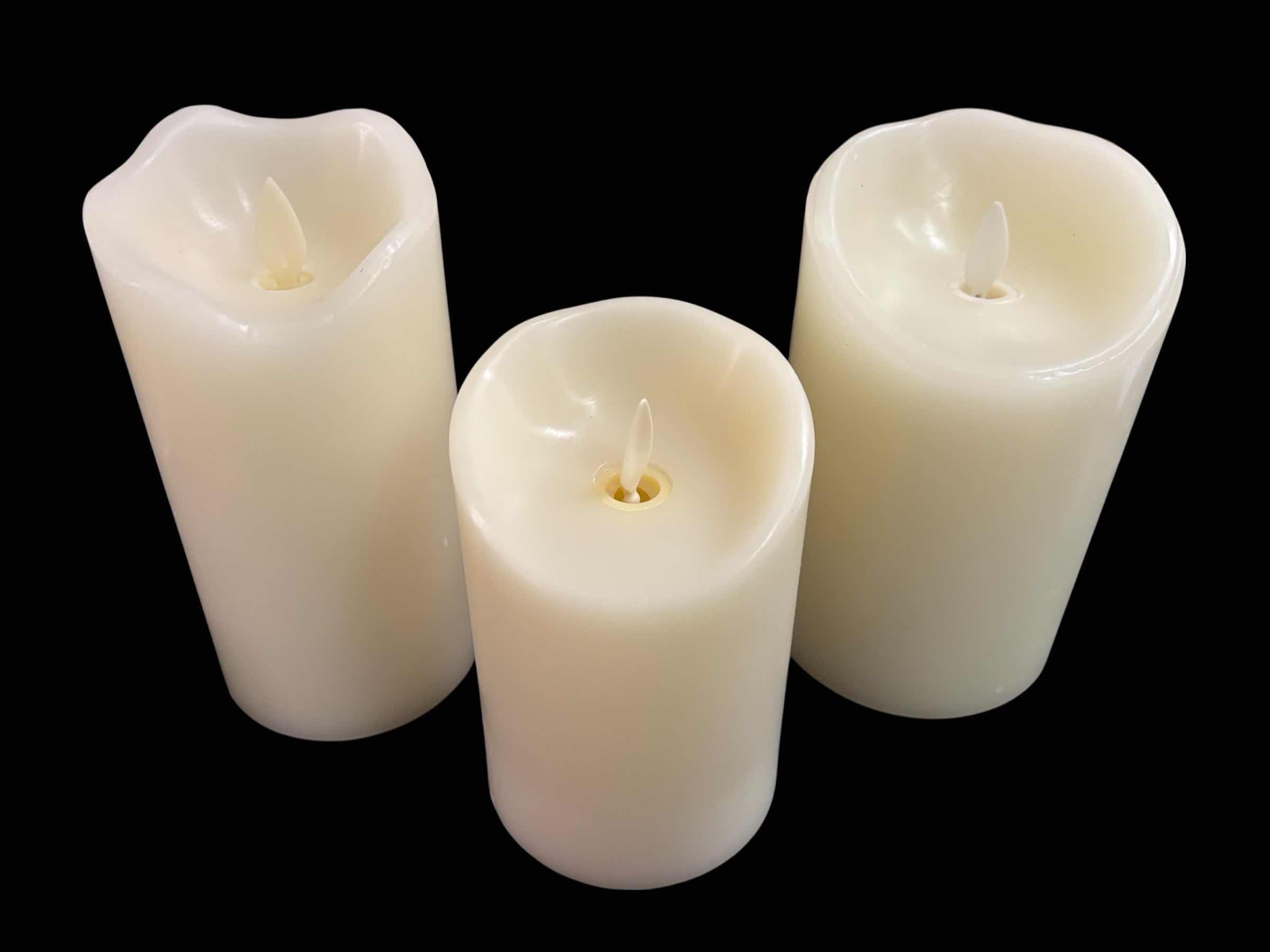 Photo 1 of FLICKERING FLAMELESS LED CANDLES W TIMER SETTING, SET OF 3, IVORY COLOR W MELTED TOP (4.75”, 5.75” & 6”)