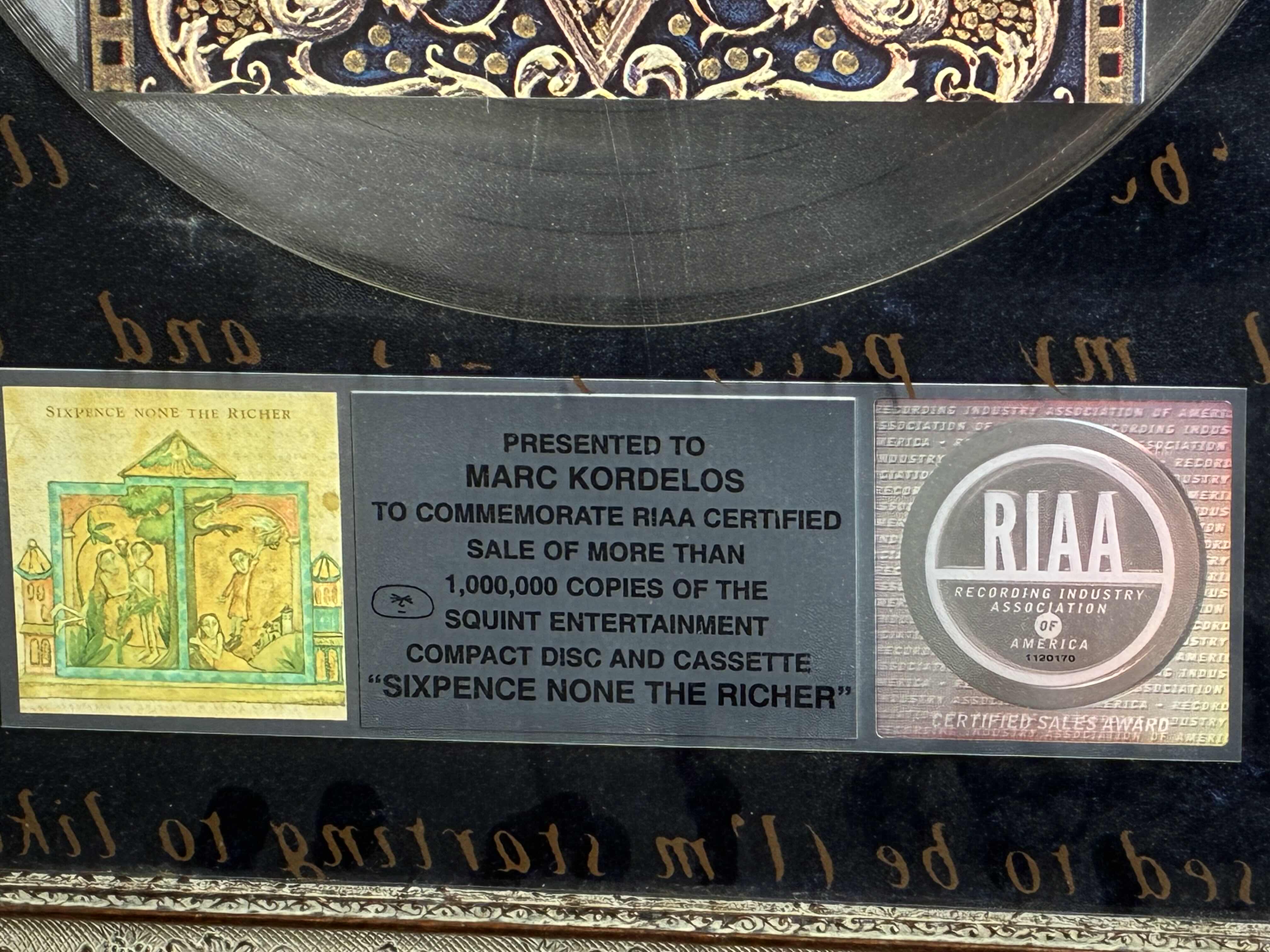 Photo 1 of PLATINUM RECORD PRESENTED TO MARC KORDELOS COMMEMORATE RIAA CERTIFIED SALE OF MORE THAN $1M COPIES OF THE SQUINT ENTERTAINMENT COMPACT DISC & CASSETTE "SIXPENCE NONE THE RICHER" FRAMED PLAQUE 17“ X 21“