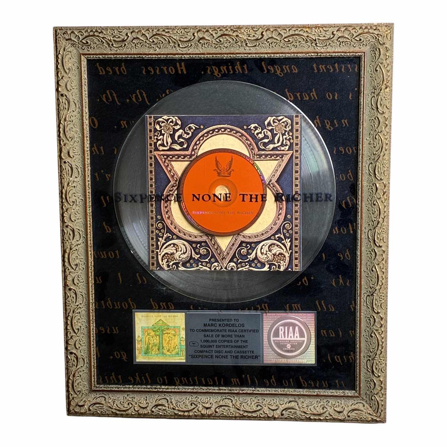Photo 1 of PLATINUM RECORD PRESENTED TO MARC KORDELOS COMMEMORATE RIAA CERTIFIED SALE OF MORE THAN $1M COPIES OF THE SQUINT ENTERTAINMENT COMPACT DISC & CASSETTE "SIXPENCE NONE THE RICHER" FRAMED PLAQUE 17“ X 21“