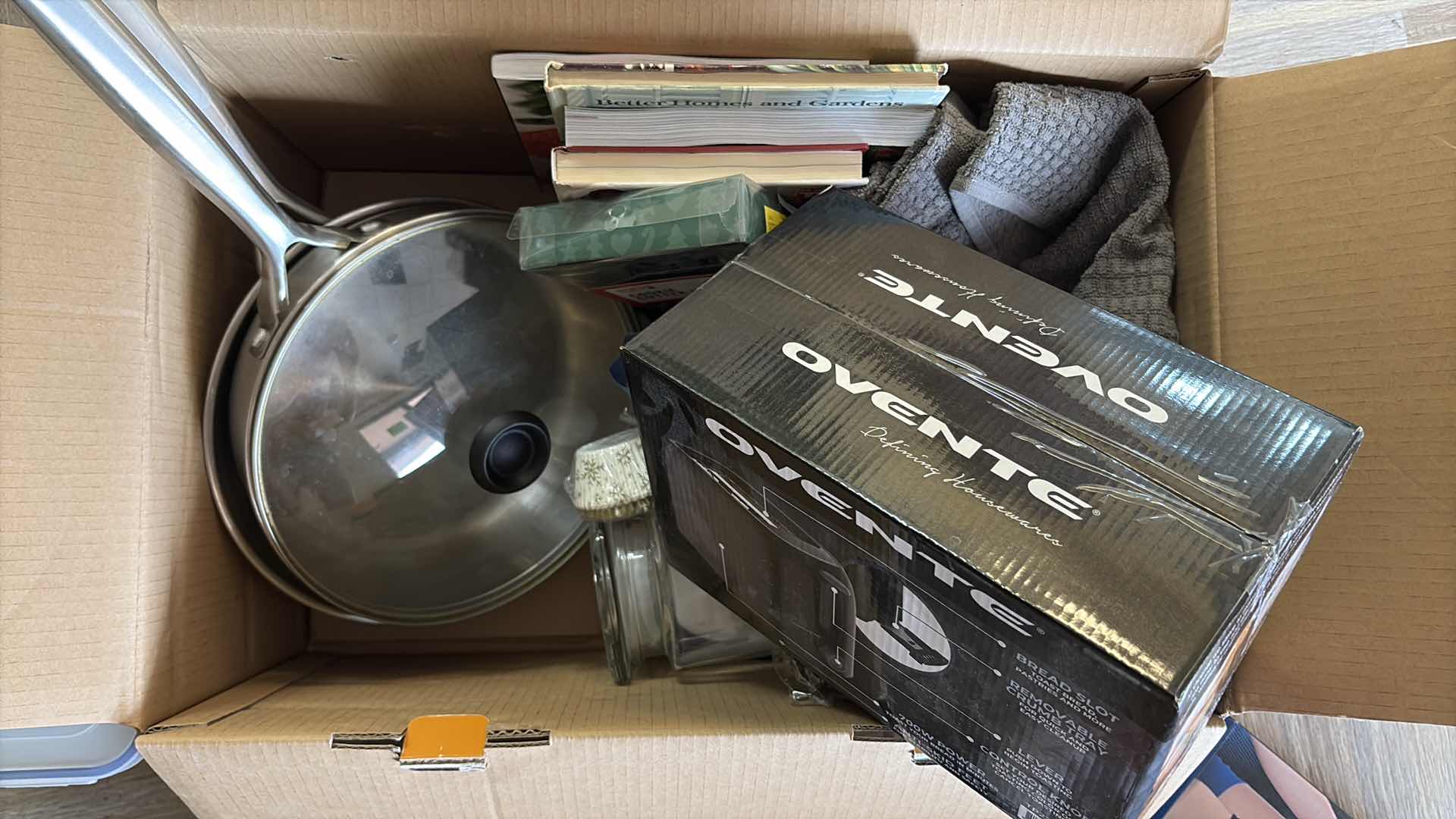 Photo 1 of BOX OF KITCHENWARE- TOASTER, PANS & COOKBOOKS