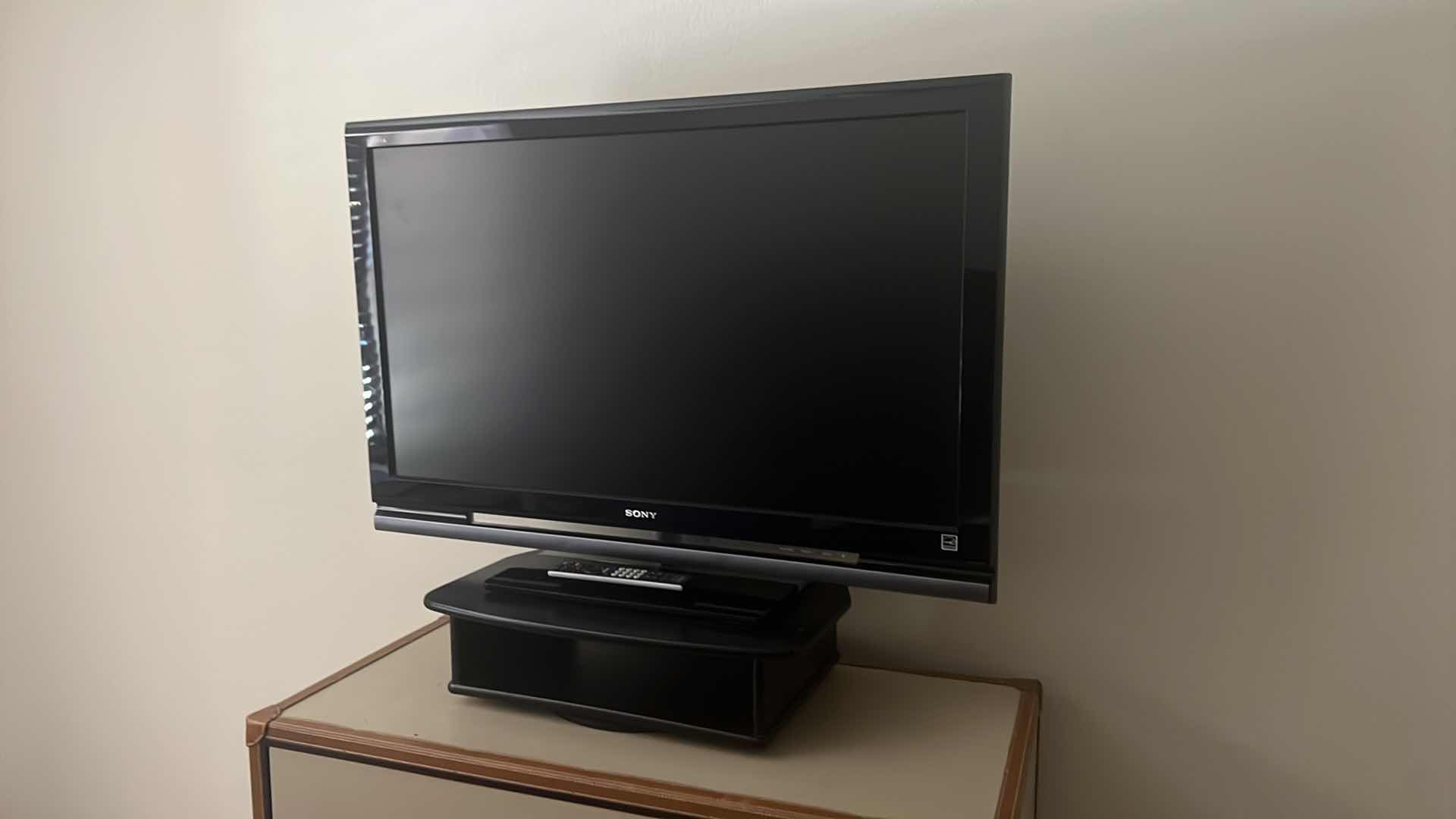 Photo 2 of 42" SONY TV W REMOTE ON SWIVEL STAND