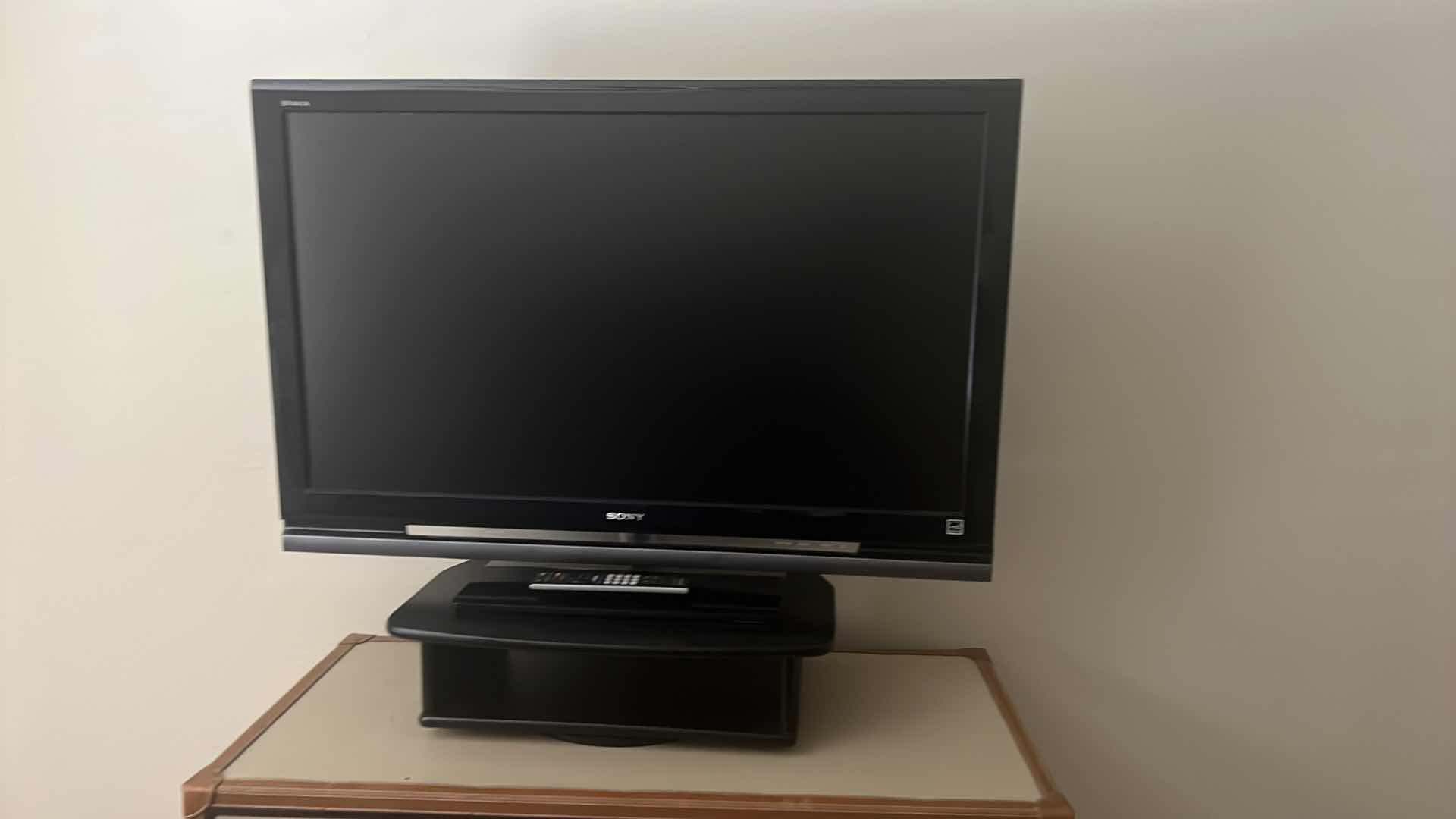 Photo 1 of 42" SONY TV W REMOTE ON SWIVEL STAND