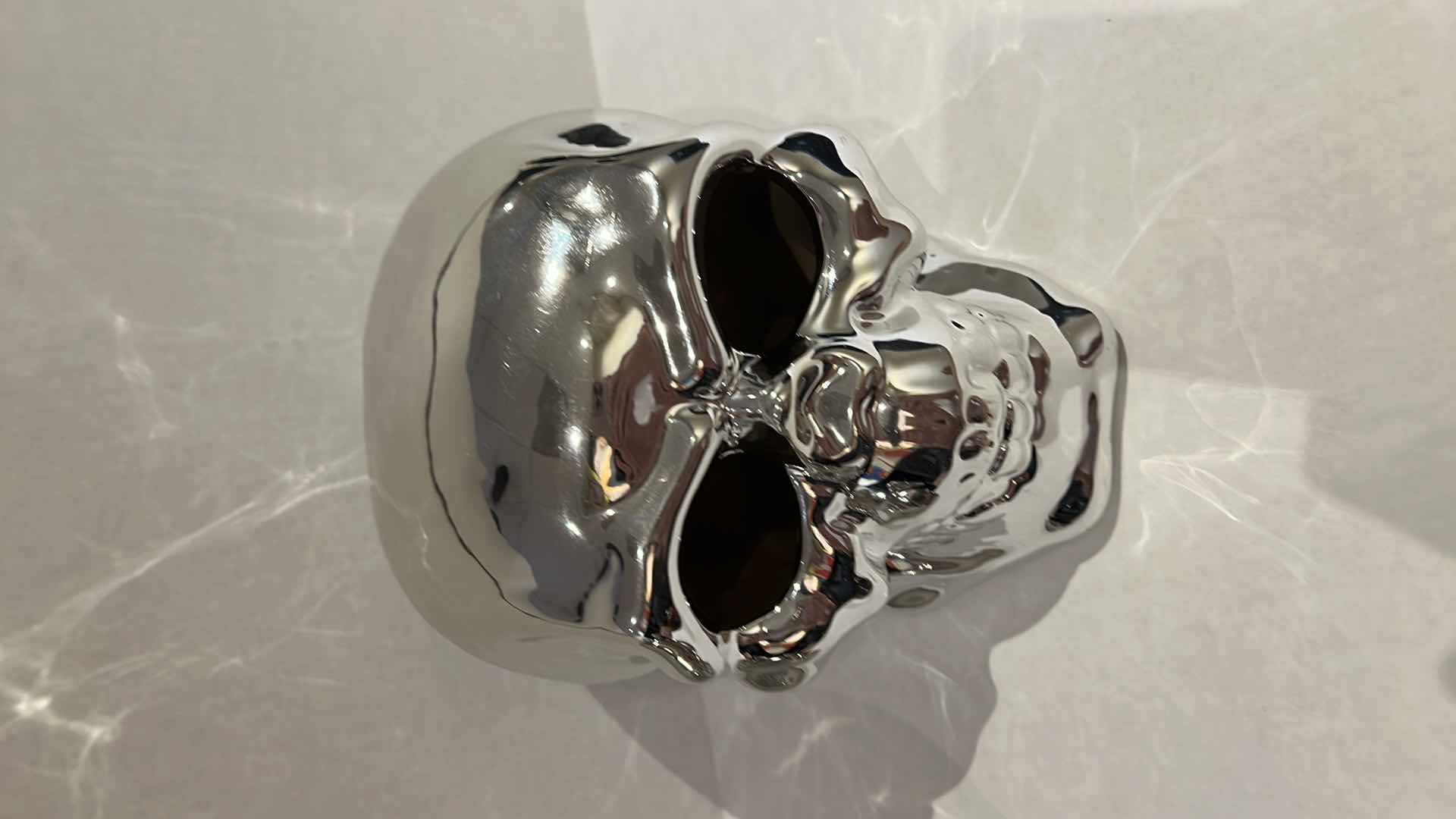 Photo 3 of 2-SILVER CERAMIC SKULLS. SMALLER ONE IS A PIGGY BANK, H5” LARGER SKULL LIGHTS UP, H6”