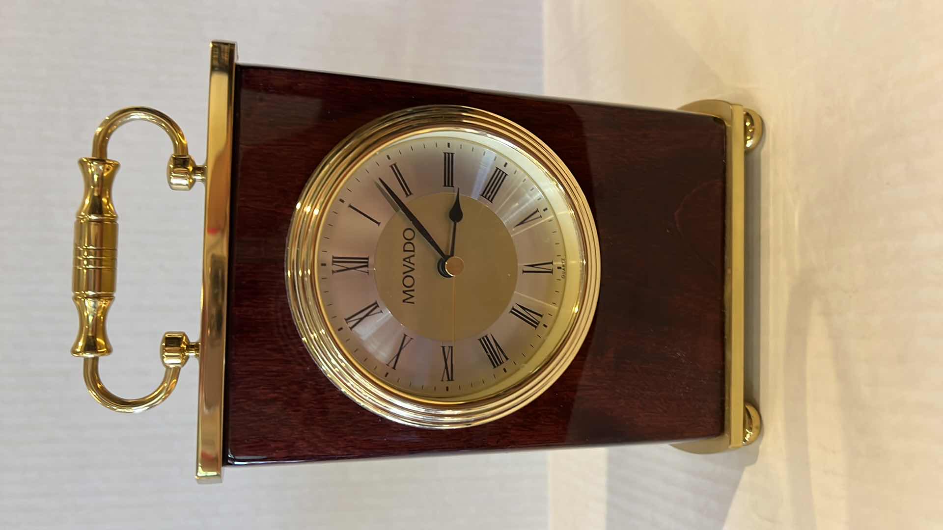 Photo 1 of MOVADO REDWOOD MANTLE CLOCK. H8.5”