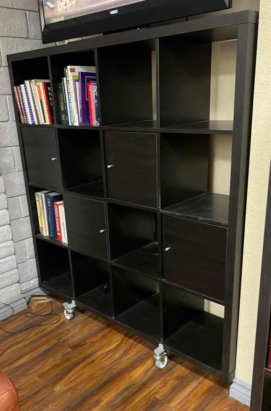 Photo 2 of IKEA BLACK KALLAX SHELVING UNIT  WHEELS W BOOKS  59" x 16" H60 