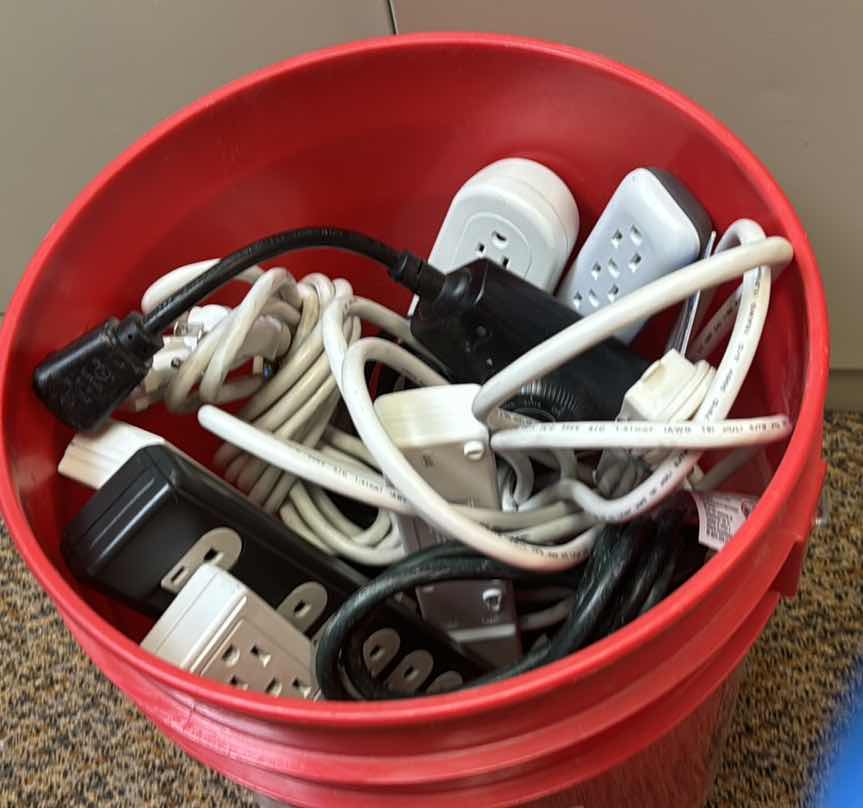 Photo 1 of FIVE GALLON BUCKET OF SURGE PROTECTORS AND EXTENSION CORDS