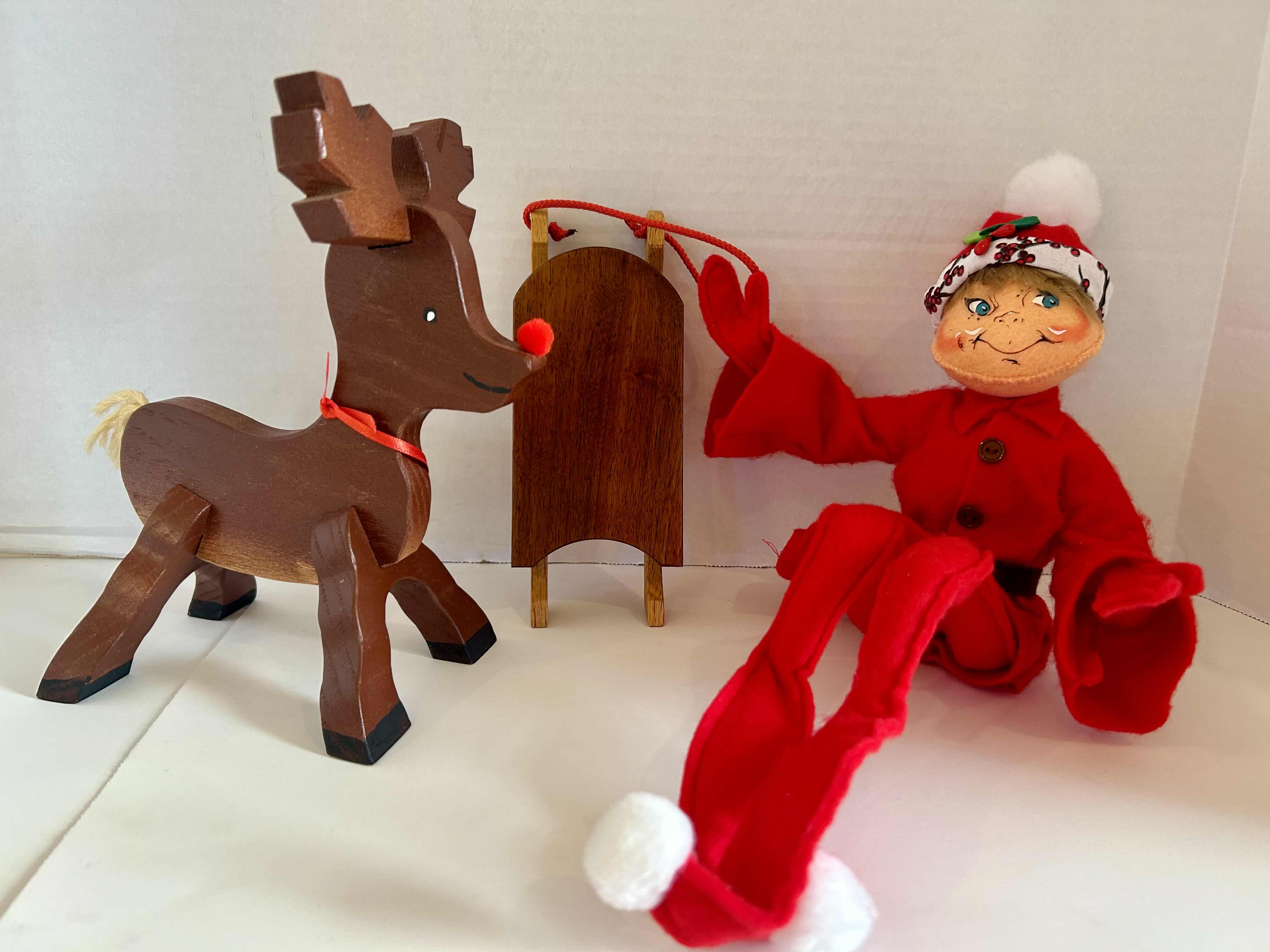 Photo 1 of 3 ITEMS OF CHRISTMAS DECOR (1) WOOD SLED, (1) WOOD REINDEER (1) FLEXIBLE ELF