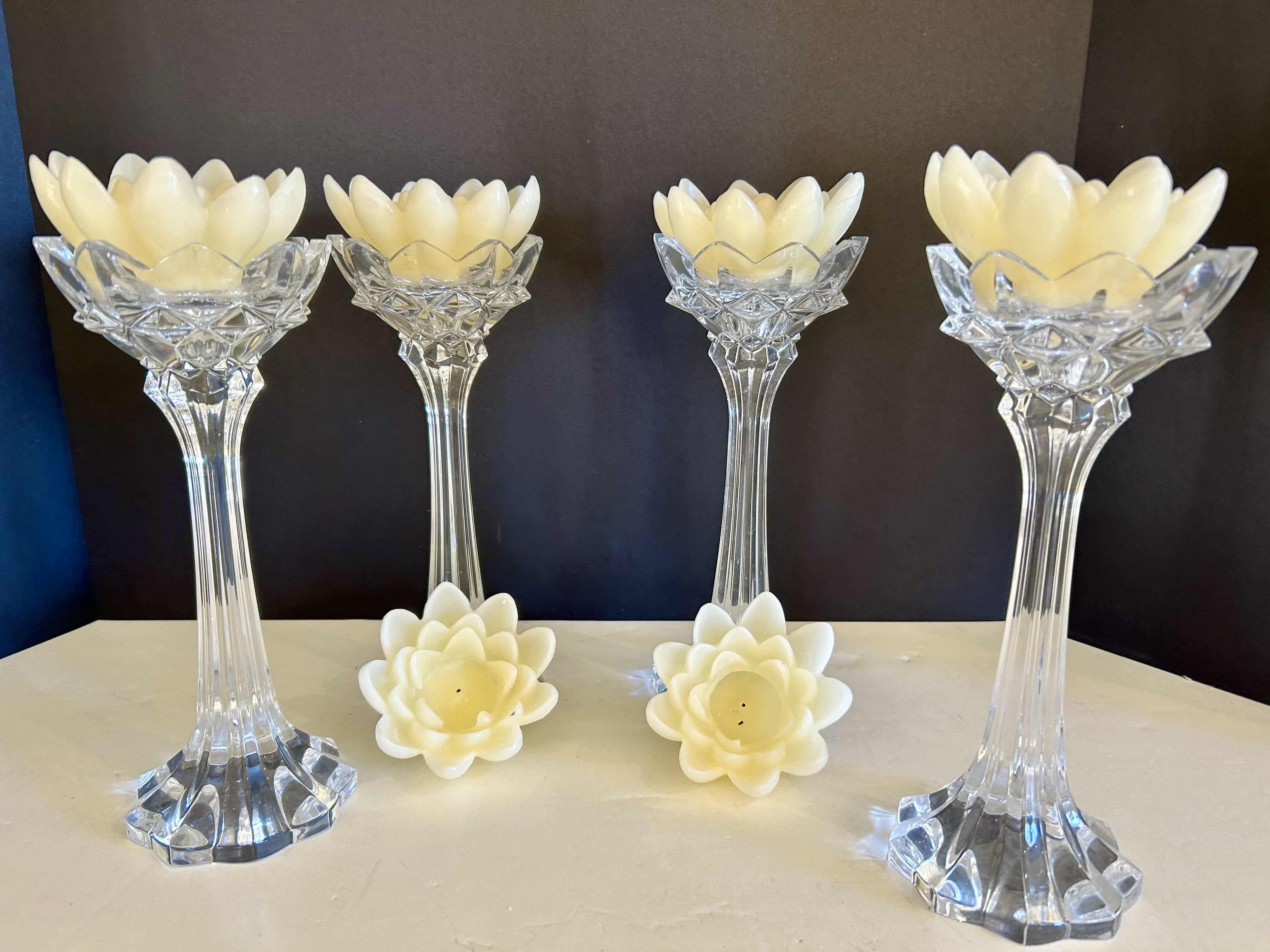 Photo 1 of (4) 10”H CRYSTAL VOTIVE HOLDERS WITH FLOWER SHAPED VOTIVE CANDLES