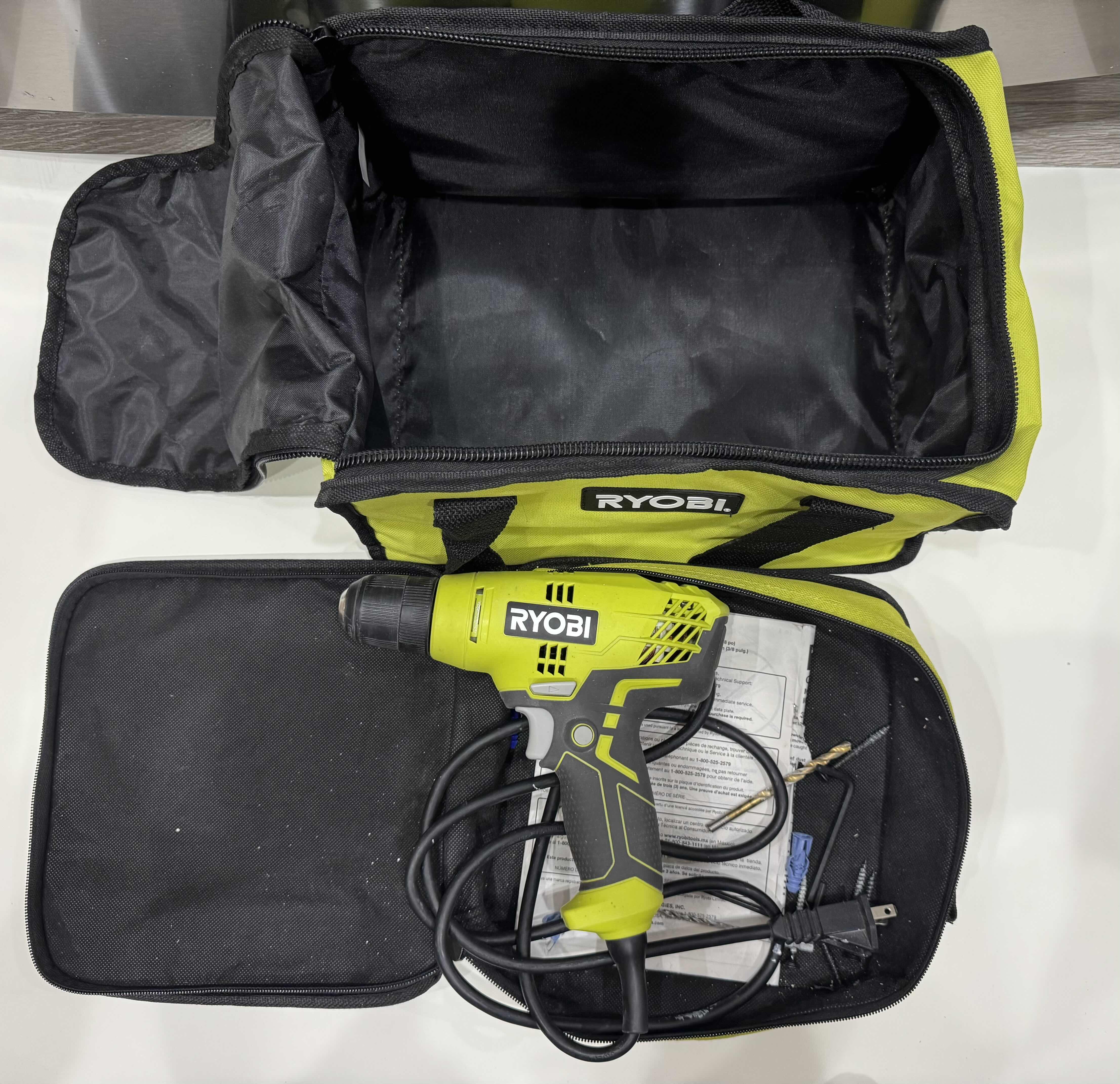 Photo 1 of POWER TOOLS-RYOBI POWER DRILL/DRIVER PLUS BITS, AND CARRYING BAGS.