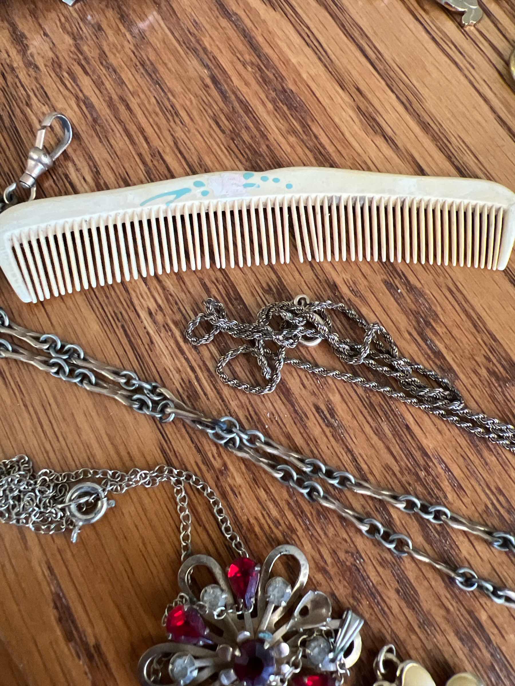 Photo 1 of LOT INCLUDING VINTAGE NECKLACES, PENDANTS, AND BAKELITE COMB EMBELLISHED WITH FLOWERS