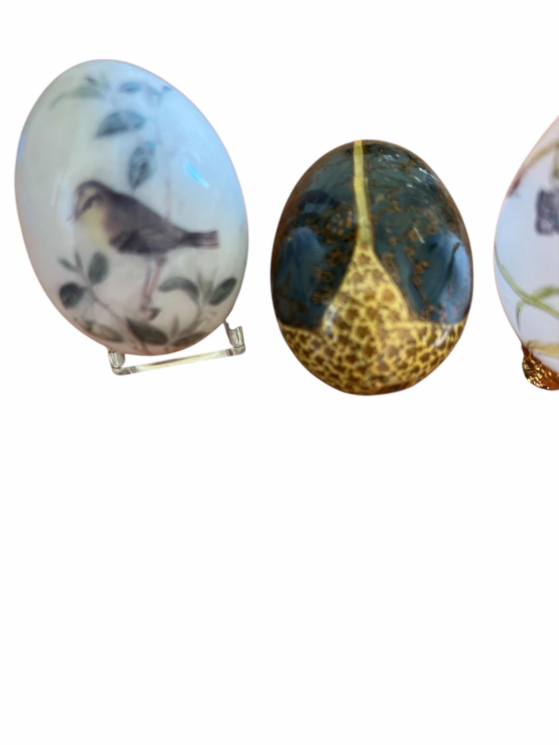 Photo 1 of TWO AVON SEASONS TREASURES EGGS, ONE HAND BLOWN GLASS EGGS AND ONE HAND PAINTED WOODEN EGG