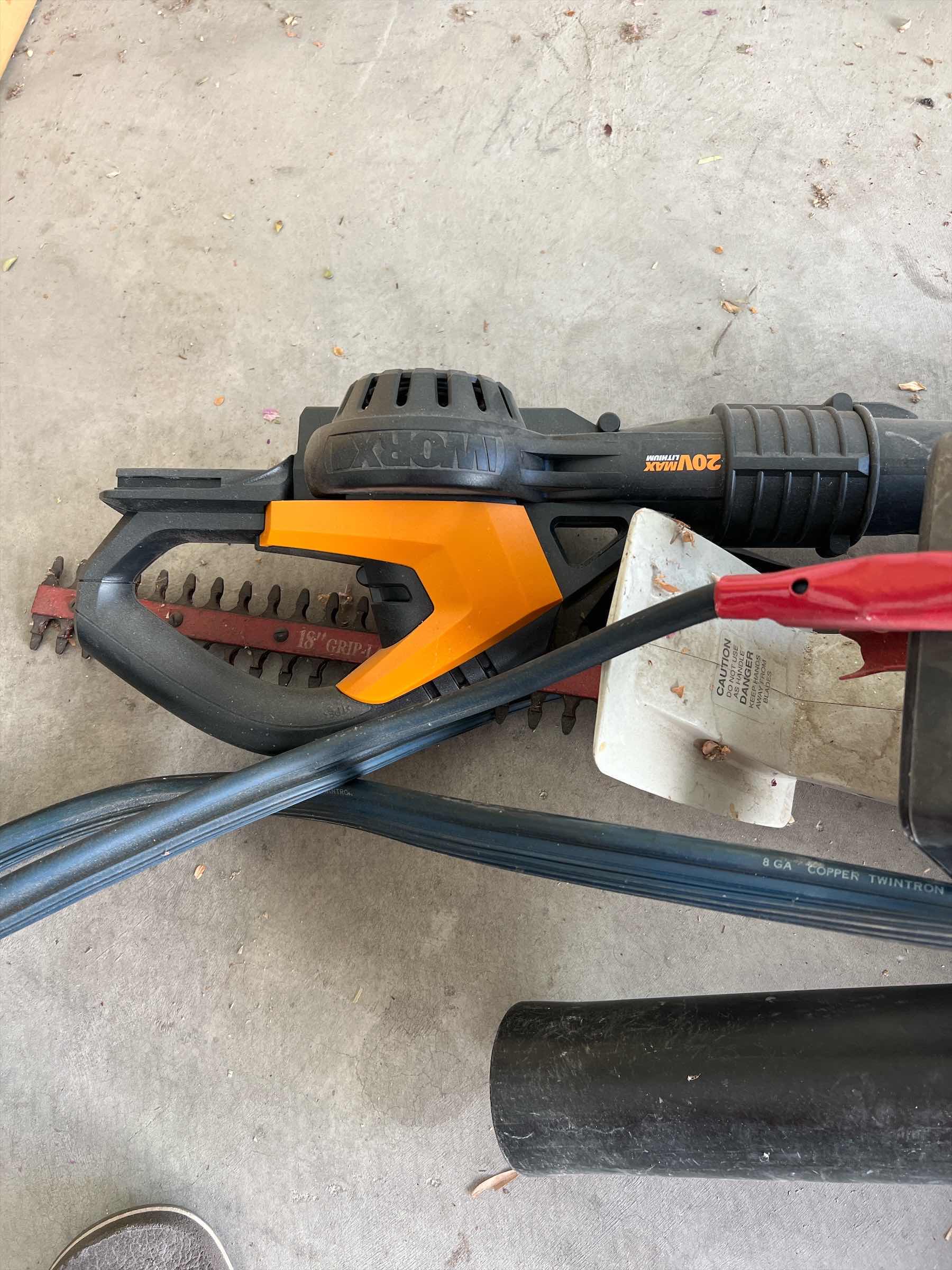 Photo 1 of LOT OF CORDED GARDEN TOOLS - IDO 18” HEDGER. - WEED EATER HOME AND YARD VAC AND IWORX LEAF BLOWER AND JUMPER CABLES