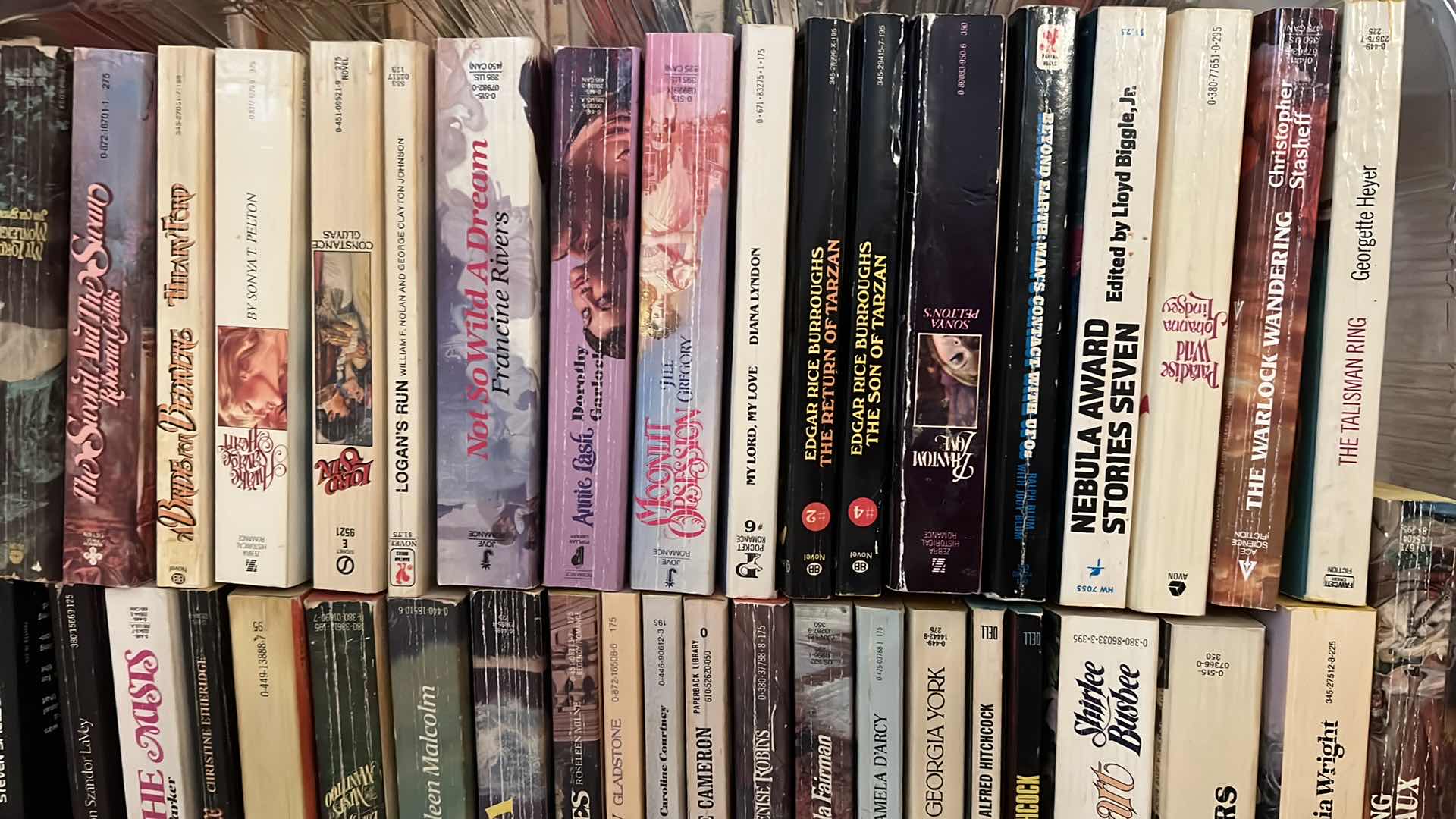 Photo 1 of PLASTIC TRAY OF PAPERBACK BOOKS AND MORE