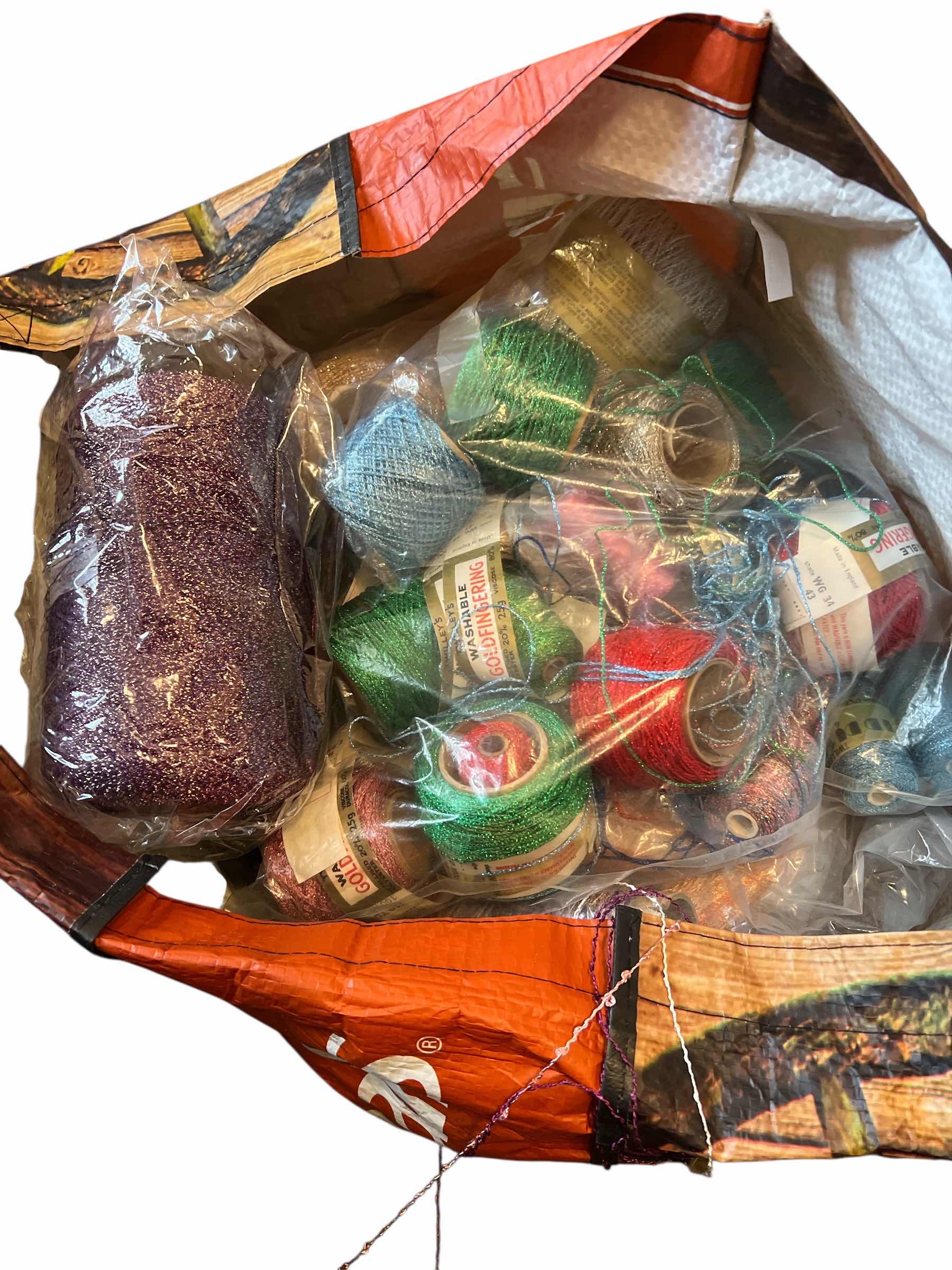 Photo 1 of BAG OF CONES OF THREAD AND SPOOLS OF SHINY METALLIC THREAD