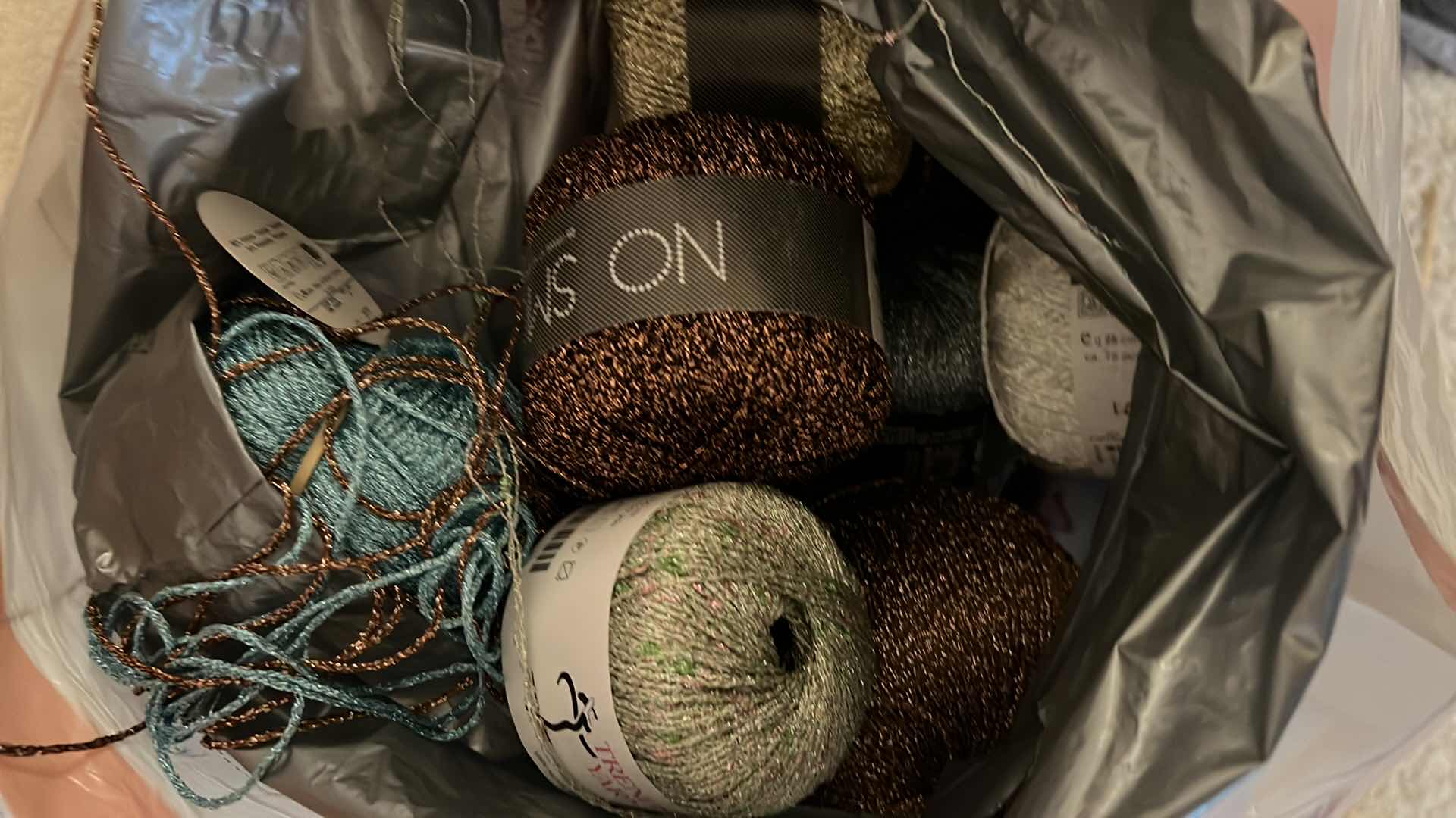 Photo 1 of BAG OF BLACK FABRIC, THREAD AND EMBROIDERY YARN