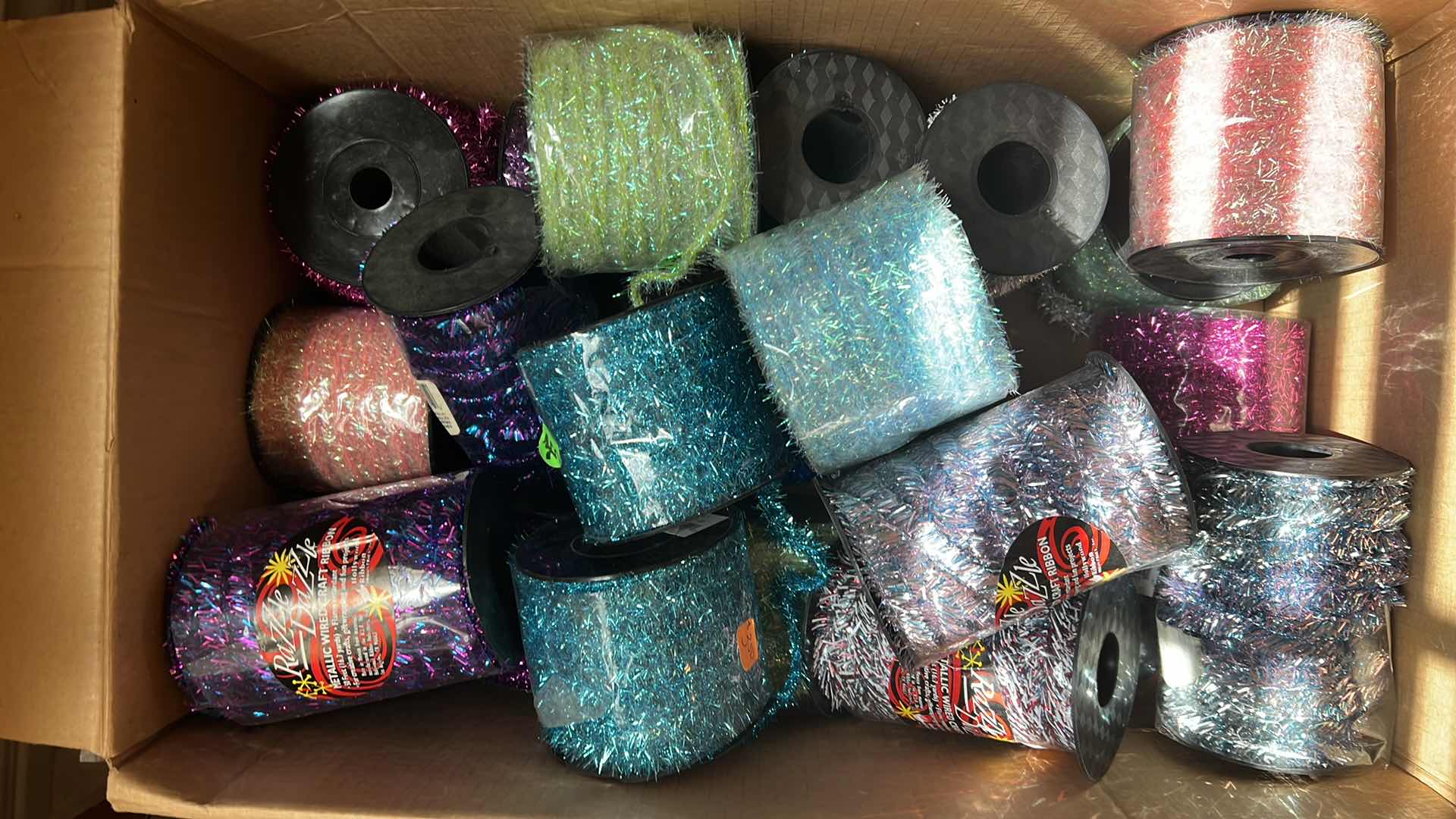 Photo 1 of BOX OF RAZZLE DAZZLE METALLIC WIRE CRAFT RIBBON AND MORE