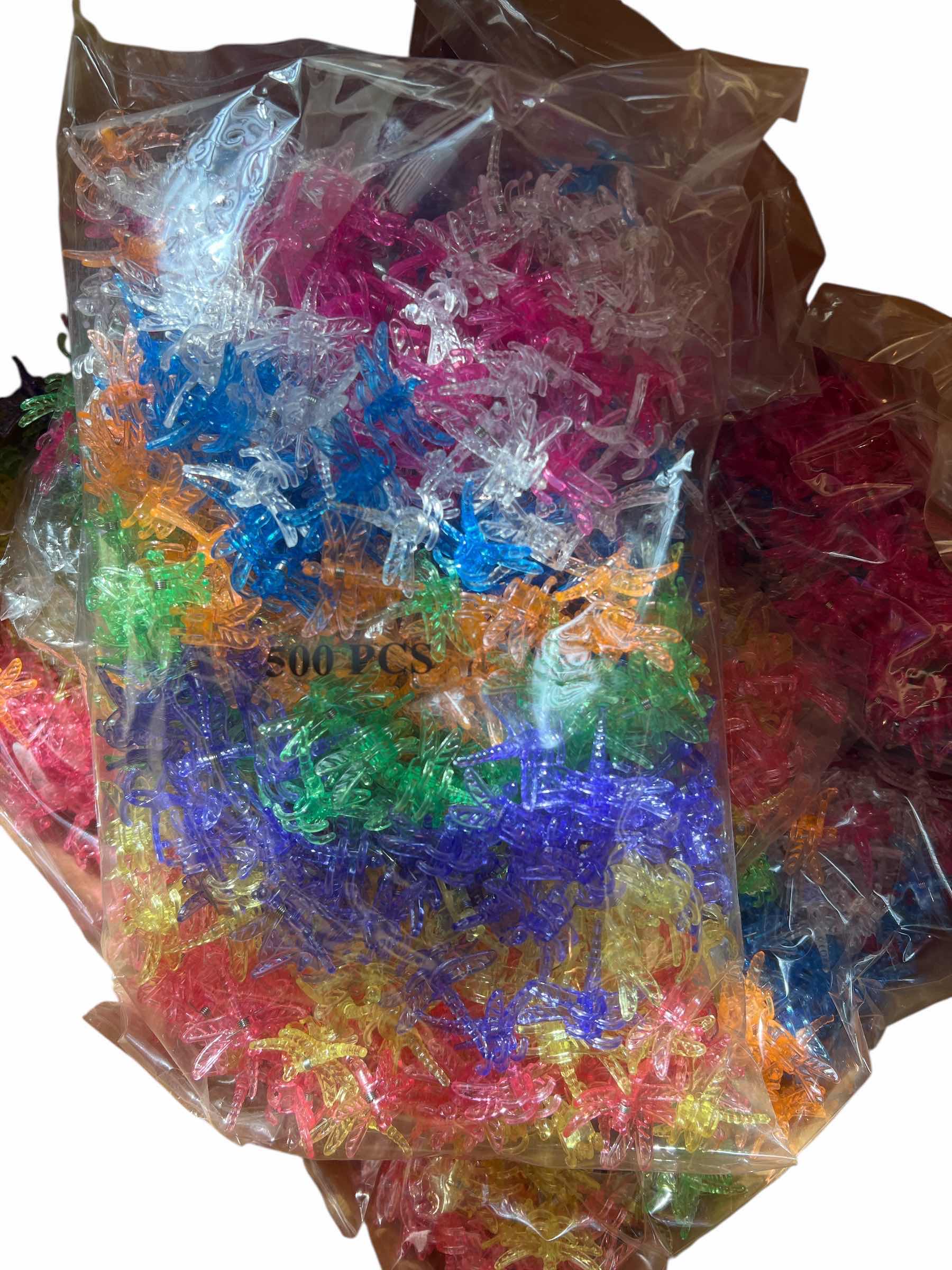 Photo 1 of CASE OF BAGS OF PLASTIC DRAGONFLY PLANT CLIP FLORIST. FLORAL