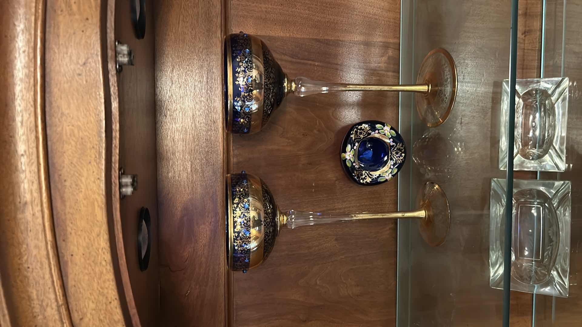 Photo 1 of 2 VINTAGE BOHEMIAN-STYLE COBALT AND GILT ART GLASS PEDESTAL COMPOTE / GOBLET, FEATURING HEAVY GOLD ENCRUSTED FLORAL DECORATION WITH COBALT BLUE JEWELED CABOCHON ACCENTS, CLEAR STEM, AND GILT FOOT, APPROX. H13” & BOHEMIAN CZECH COBALT BLUE GLASS BOWL,