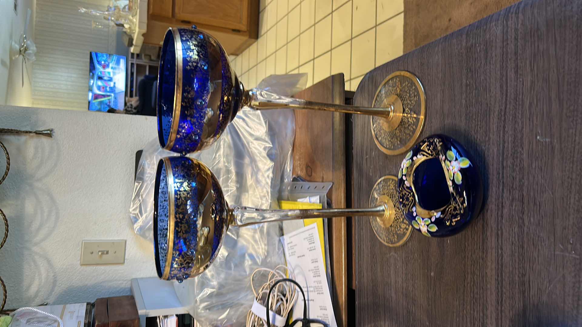 Photo 1 of 2 VINTAGE BOHEMIAN-STYLE COBALT AND GILT ART GLASS PEDESTAL COMPOTE / GOBLET, FEATURING HEAVY GOLD ENCRUSTED FLORAL DECORATION WITH COBALT BLUE JEWELED CABOCHON ACCENTS, CLEAR STEM, AND GILT FOOT, APPROX. H13” & BOHEMIAN CZECH COBALT BLUE GLASS BOWL,