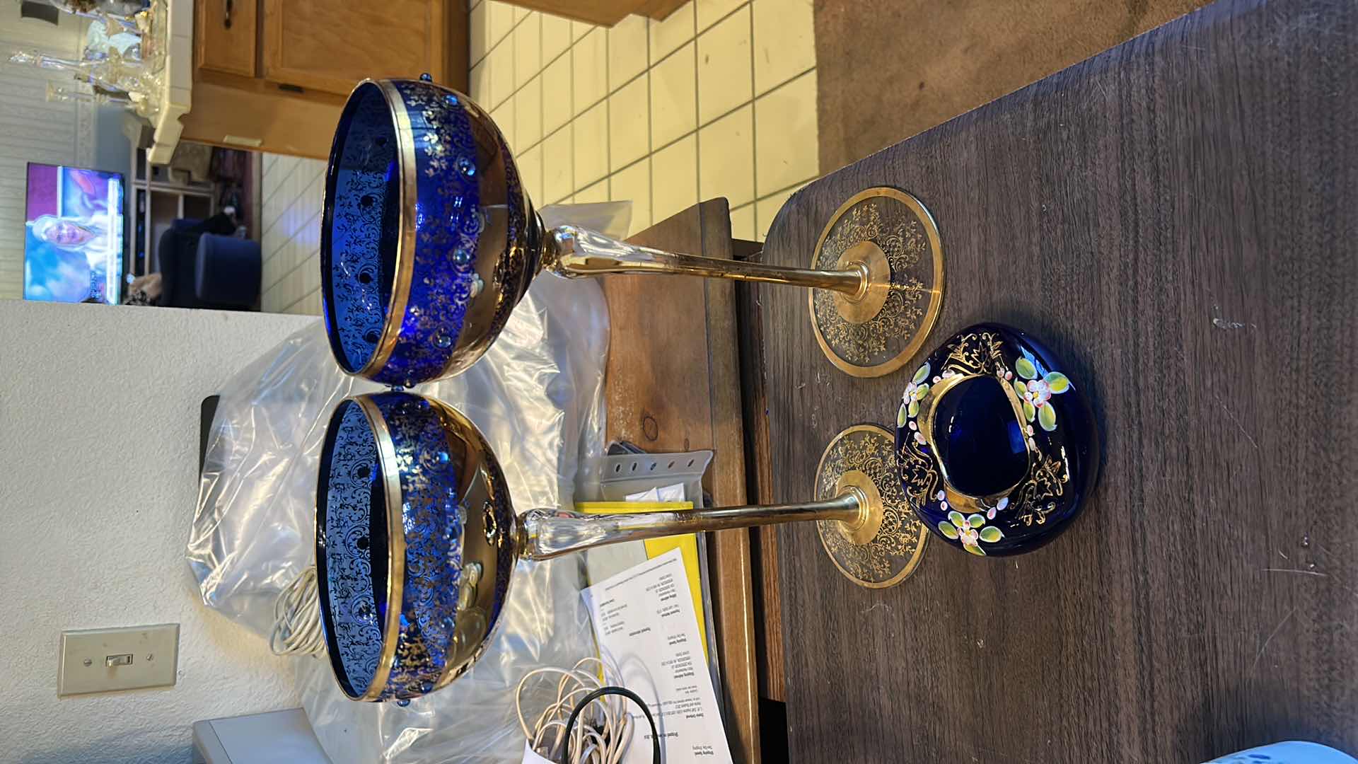 Photo 1 of 2 VINTAGE BOHEMIAN-STYLE COBALT AND GILT ART GLASS PEDESTAL COMPOTE / GOBLET, FEATURING HEAVY GOLD ENCRUSTED FLORAL DECORATION WITH COBALT BLUE JEWELED CABOCHON ACCENTS, CLEAR STEM, AND GILT FOOT, APPROX. H13” & BOHEMIAN CZECH COBALT BLUE GLASS BOWL,
