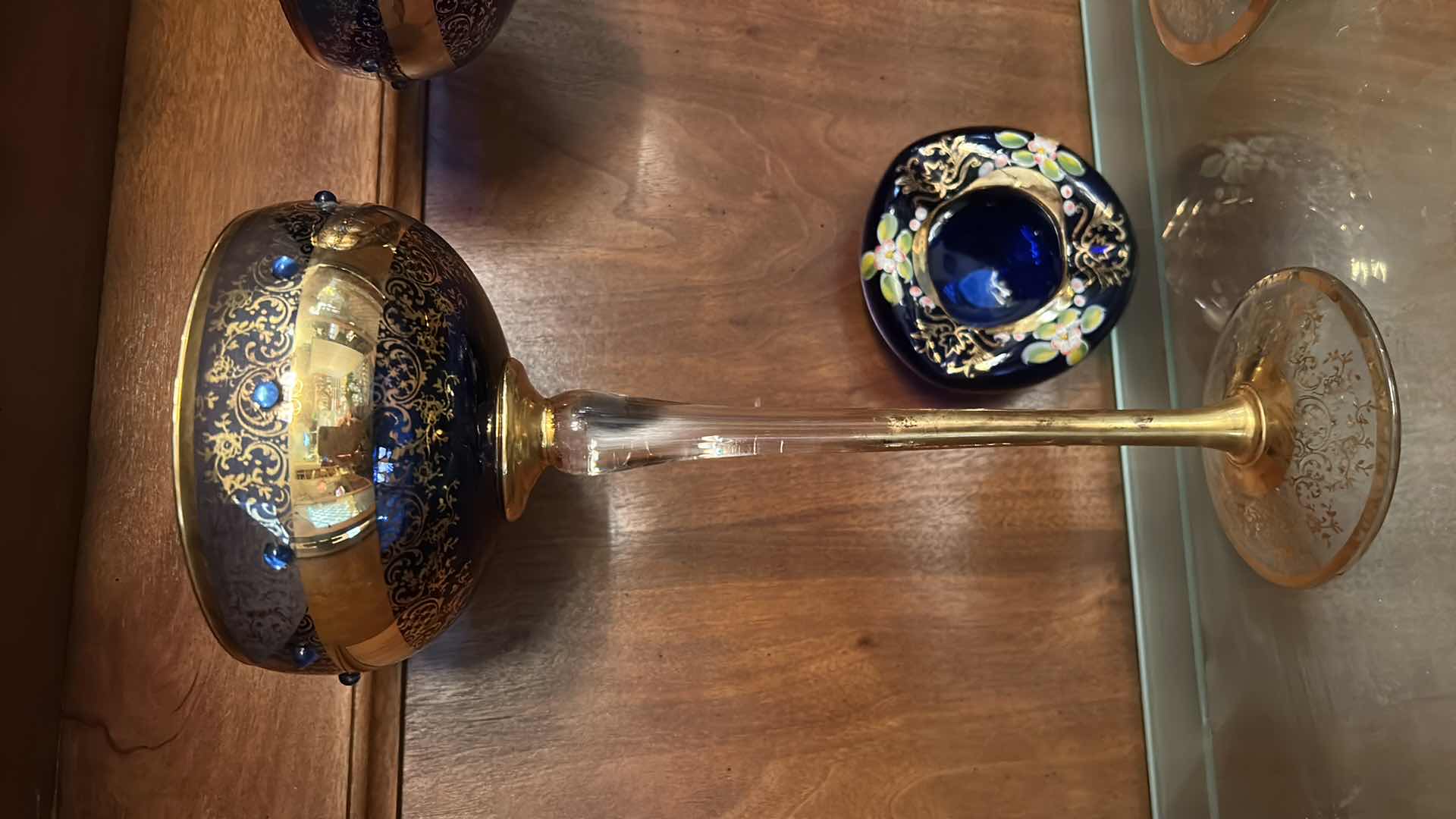 Photo 1 of 2 VINTAGE BOHEMIAN-STYLE COBALT AND GILT ART GLASS PEDESTAL COMPOTE / GOBLET, FEATURING HEAVY GOLD ENCRUSTED FLORAL DECORATION WITH COBALT BLUE JEWELED CABOCHON ACCENTS, CLEAR STEM, AND GILT FOOT, APPROX. H13” & BOHEMIAN CZECH COBALT BLUE GLASS BOWL,