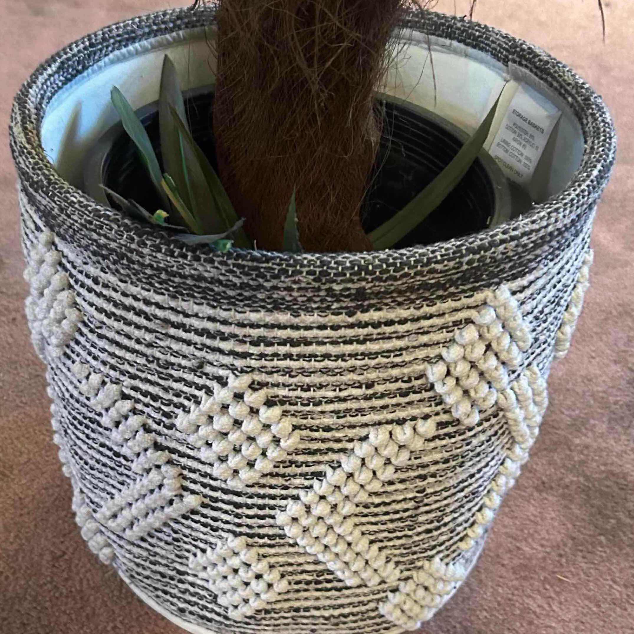Photo 1 of ARTIFICIAL PALM PLANT HOUSED IN PATTERN WOVEN POT H 5'