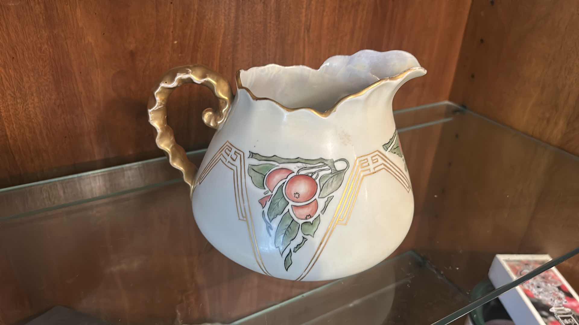 Photo 1 of ANTIQUE PORCELAIN WATER PITCHER OR CIDER JUG, LIKELY PRODUCED IN GERMANY OR FRANCE BETWEEN THE LATE 19TH AND EARLY 20TH CENTURY, FEATURING HAND-PAINTED RED CHERRY DESIGNS AND