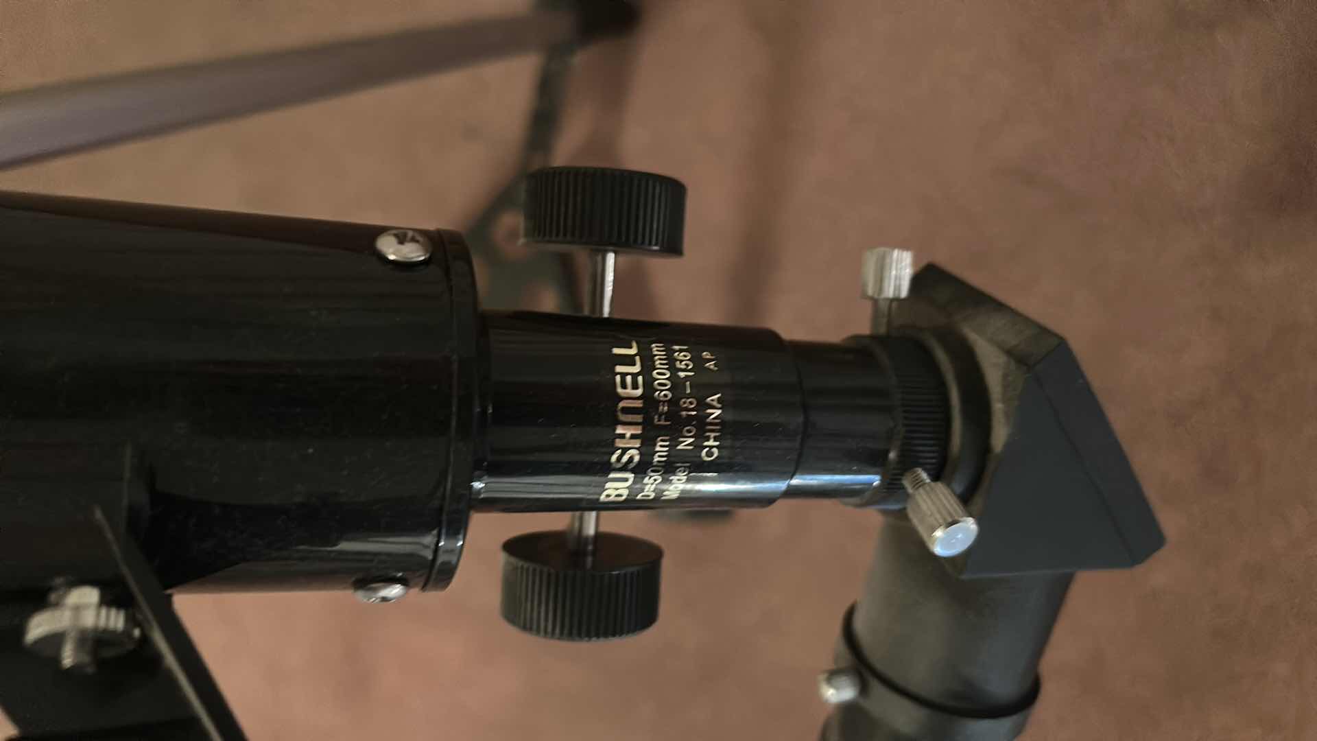Photo 1 of BUSHNELL REFRACTOR TELESCOPE ON A TRIPOD