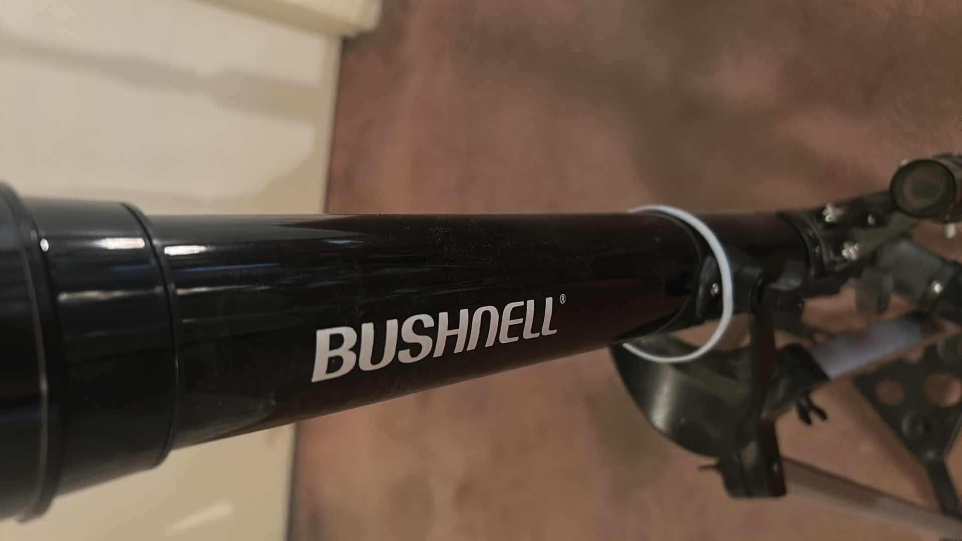 Photo 1 of BUSHNELL REFRACTOR TELESCOPE ON A TRIPOD