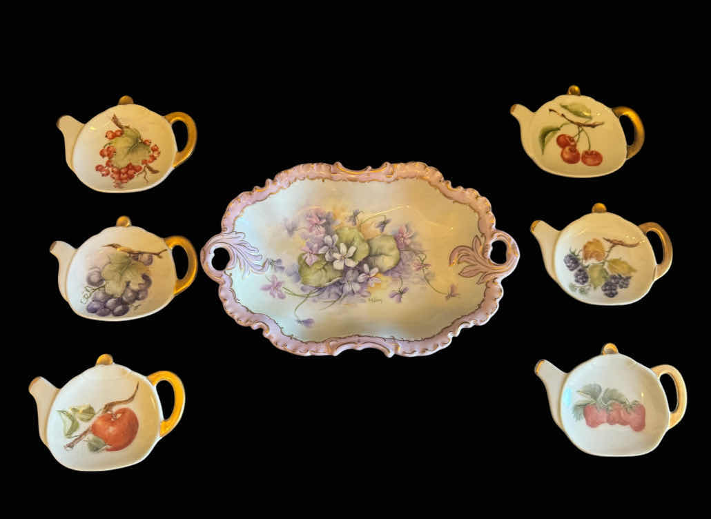 Photo 1 of VINTAGE  HAND PAINTED PORCELAIN DRESSER TRAY/TRINKET DISH, H. GIBBONS AND TEABAG HOLDER PLATES BY L. CLARK. 

TRAY/ TRINKET DISH
9.5” X 6” X H1.5”
TEABAG HOLDERS
4.5” X 3.5” X H.25”