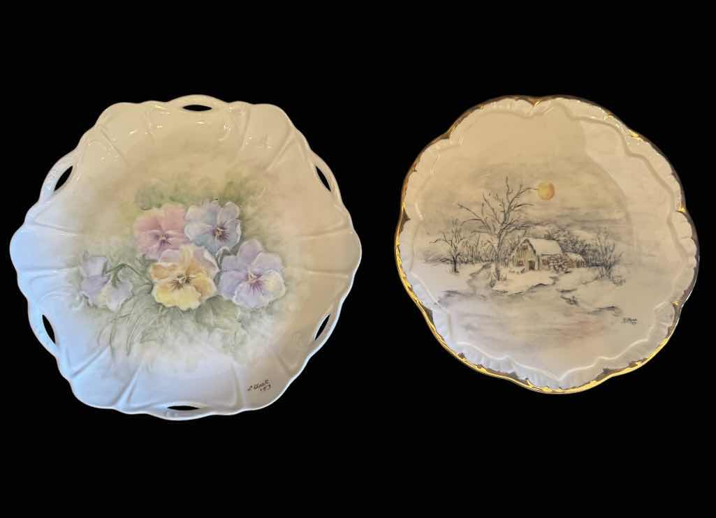 Photo 1 of VINTAGE L. CLARK PORCELAIN COLLECTABLE PLATES, 1983 AND 1987

FLORAL PLATE
D10.25”
WINTER LANDSCAPE 
D9.5”