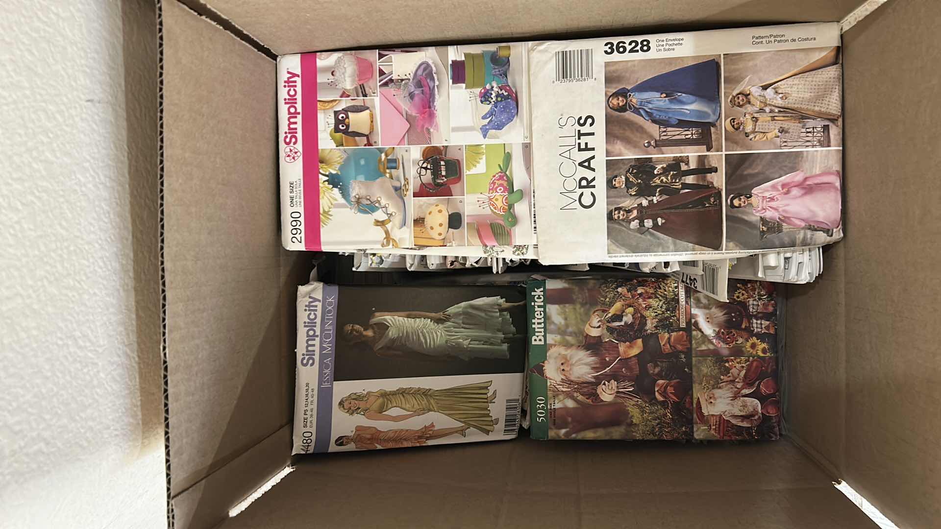Photo 1 of CONTENTS OF BOX ASSORTED SIMPLICITY PATTERNS