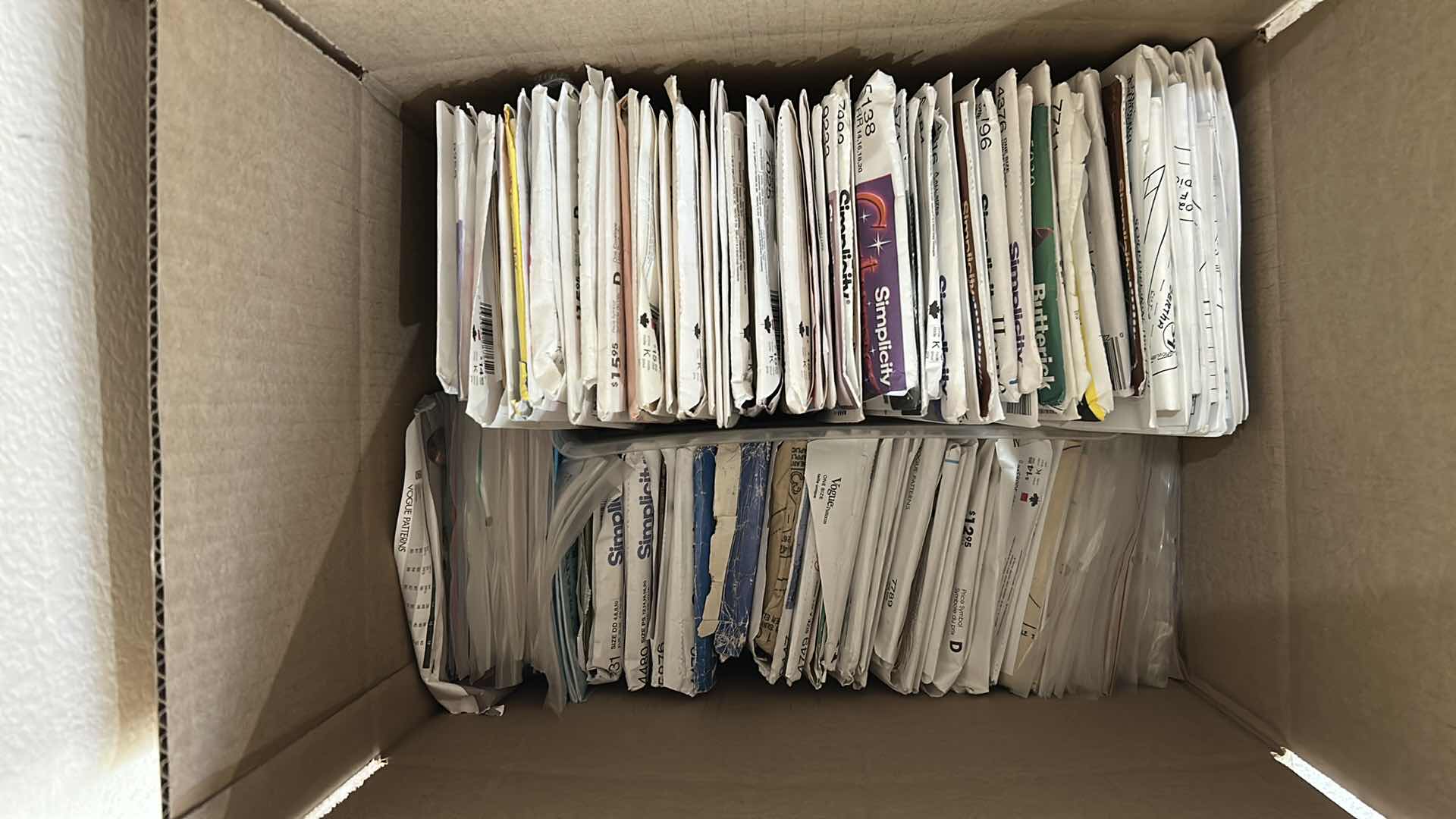 Photo 1 of CONTENTS OF BOX ASSORTED SIMPLICITY PATTERNS