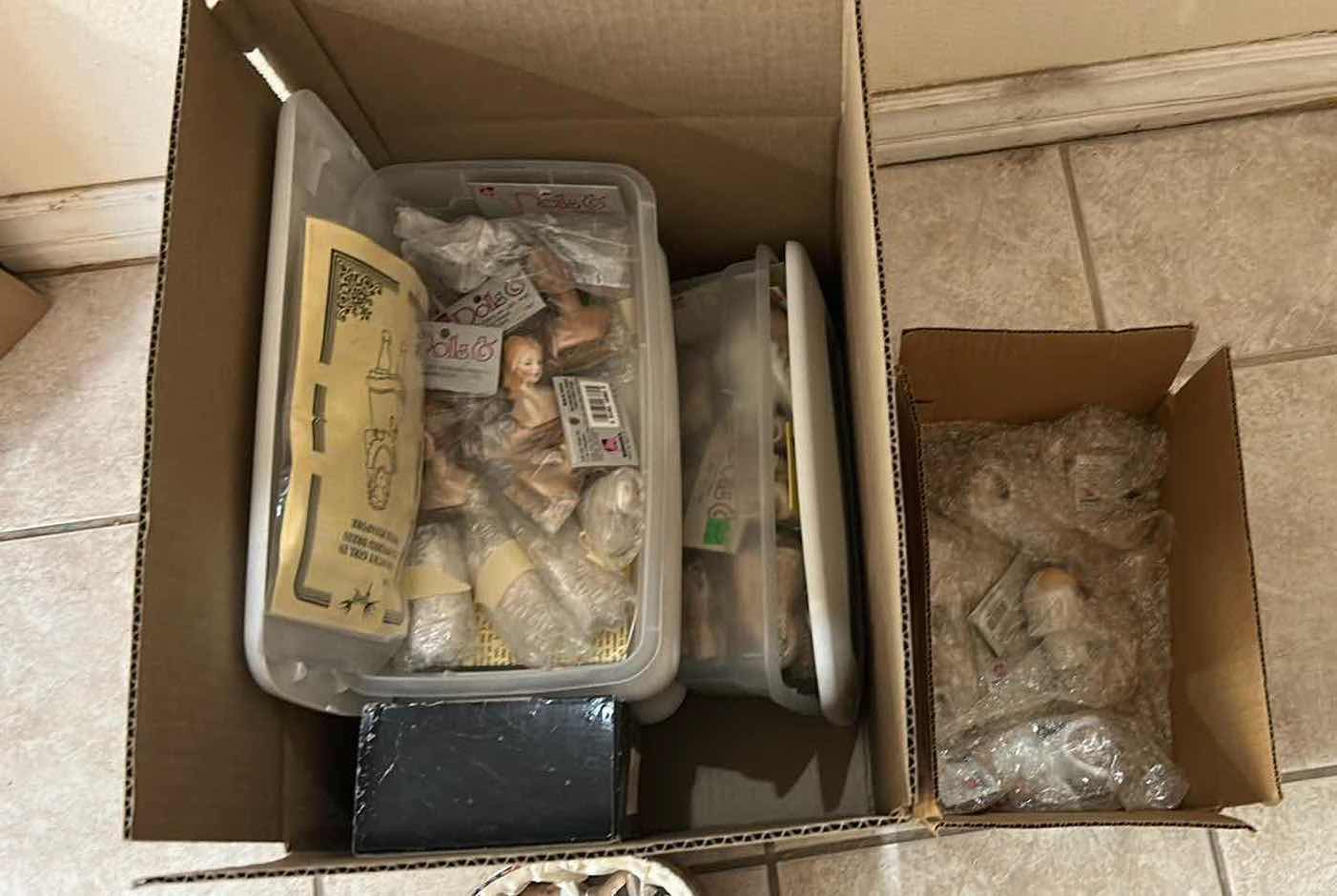 Photo 1 of CONTENTS OF BOX ASSORTED DOLL HEADS HANDS
