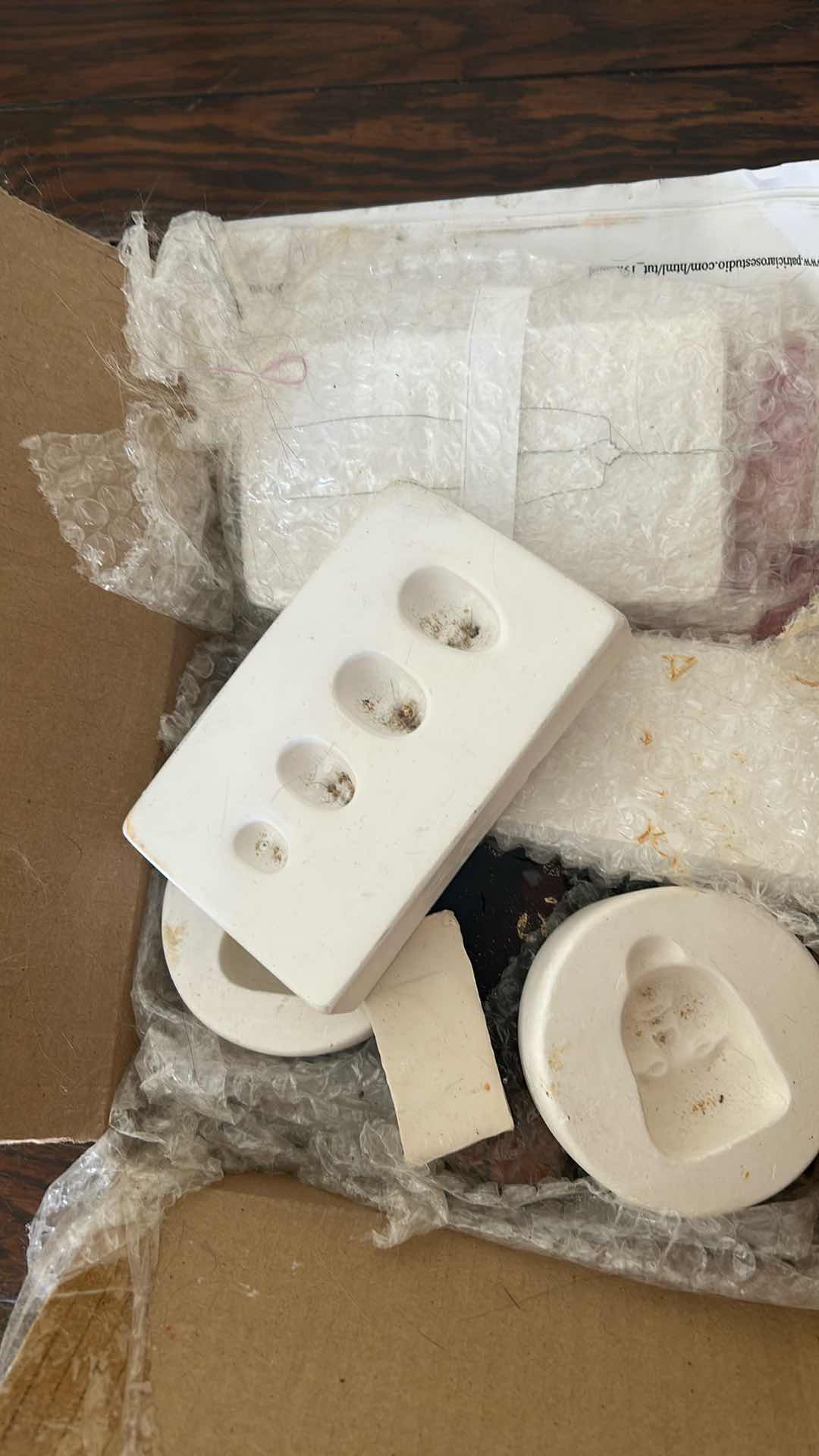 Photo 1 of 3- CONTAINERS OF DOLL MOLDS