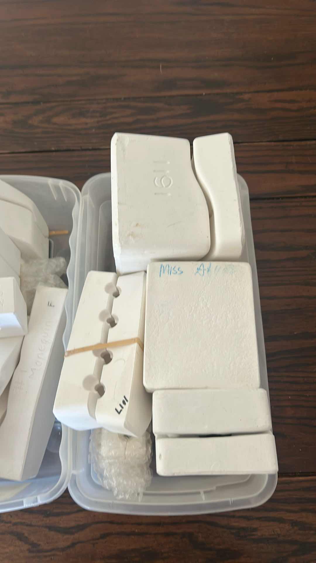 Photo 1 of 3- CONTAINERS OF DOLL MOLDS