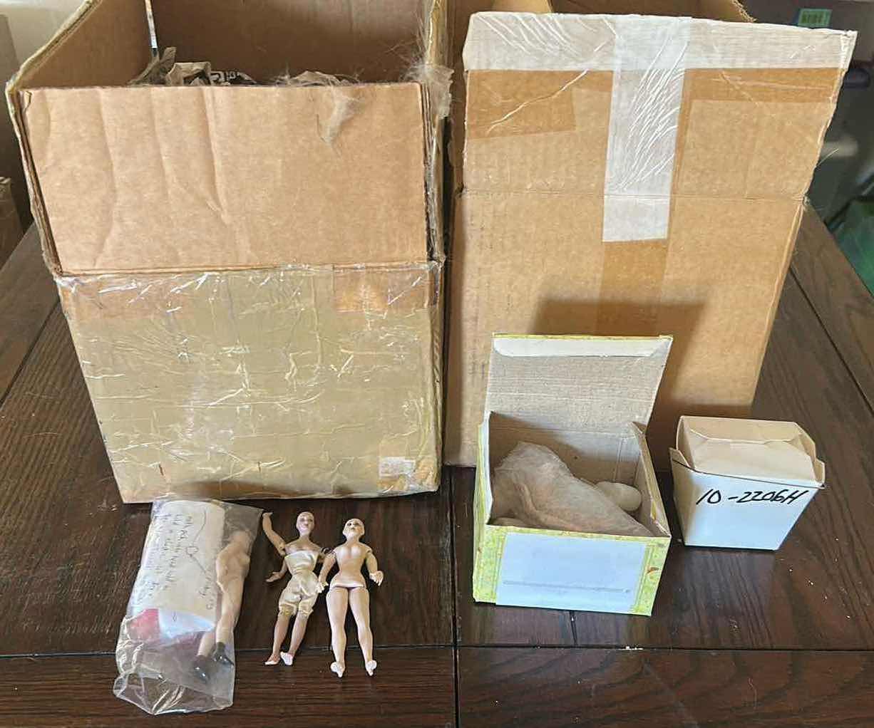 Photo 1 of CONTENTS OF 2 BOXES CERAMIC DOLL PARTS