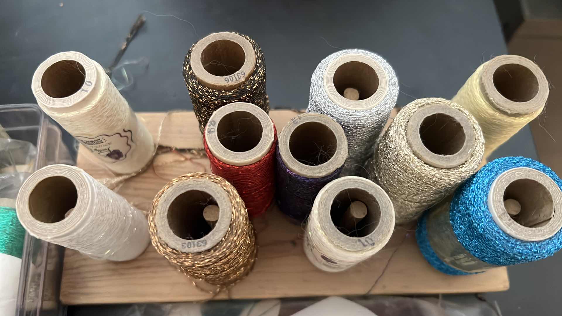 Photo 1 of EMBROIDERY THREAD AND 2 BOBBIN STANDS