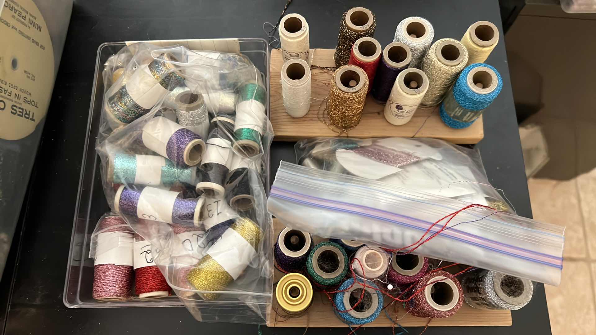 Photo 1 of EMBROIDERY THREAD AND 2 BOBBIN STANDS