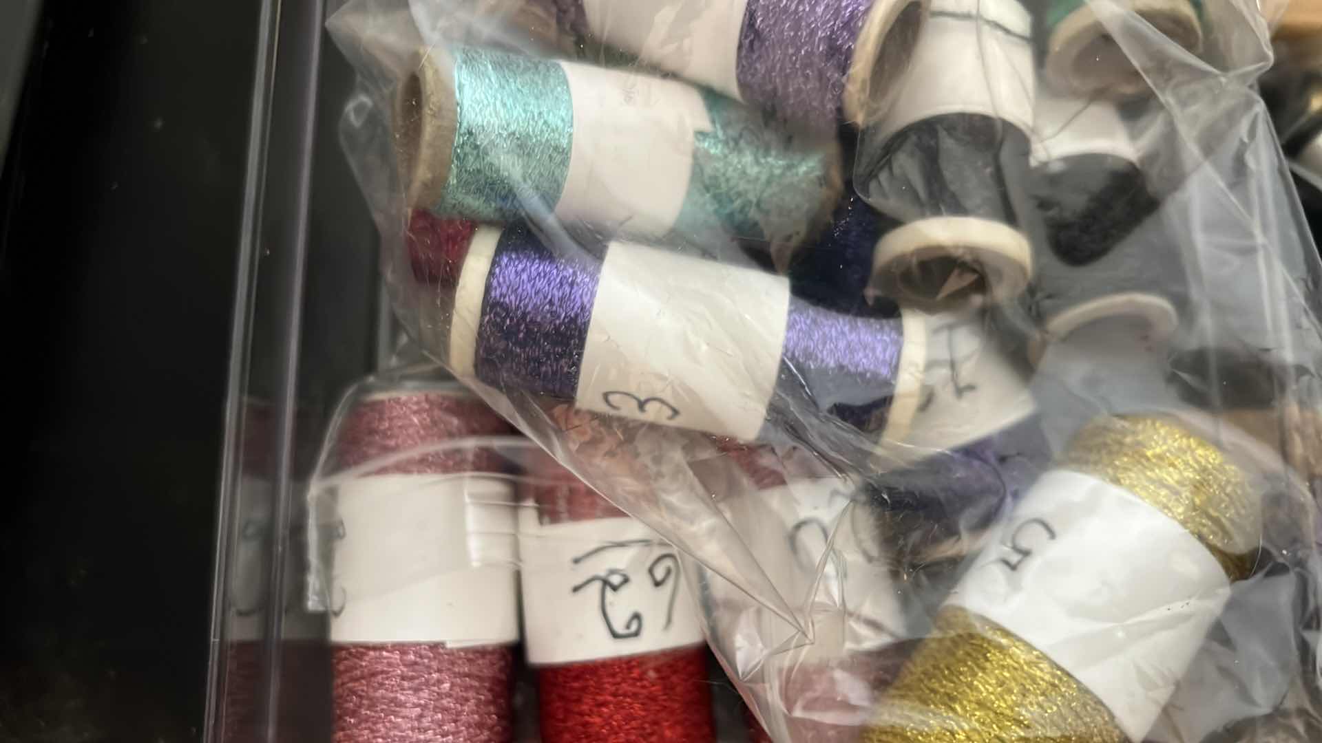 Photo 1 of EMBROIDERY THREAD AND 2 BOBBIN STANDS
