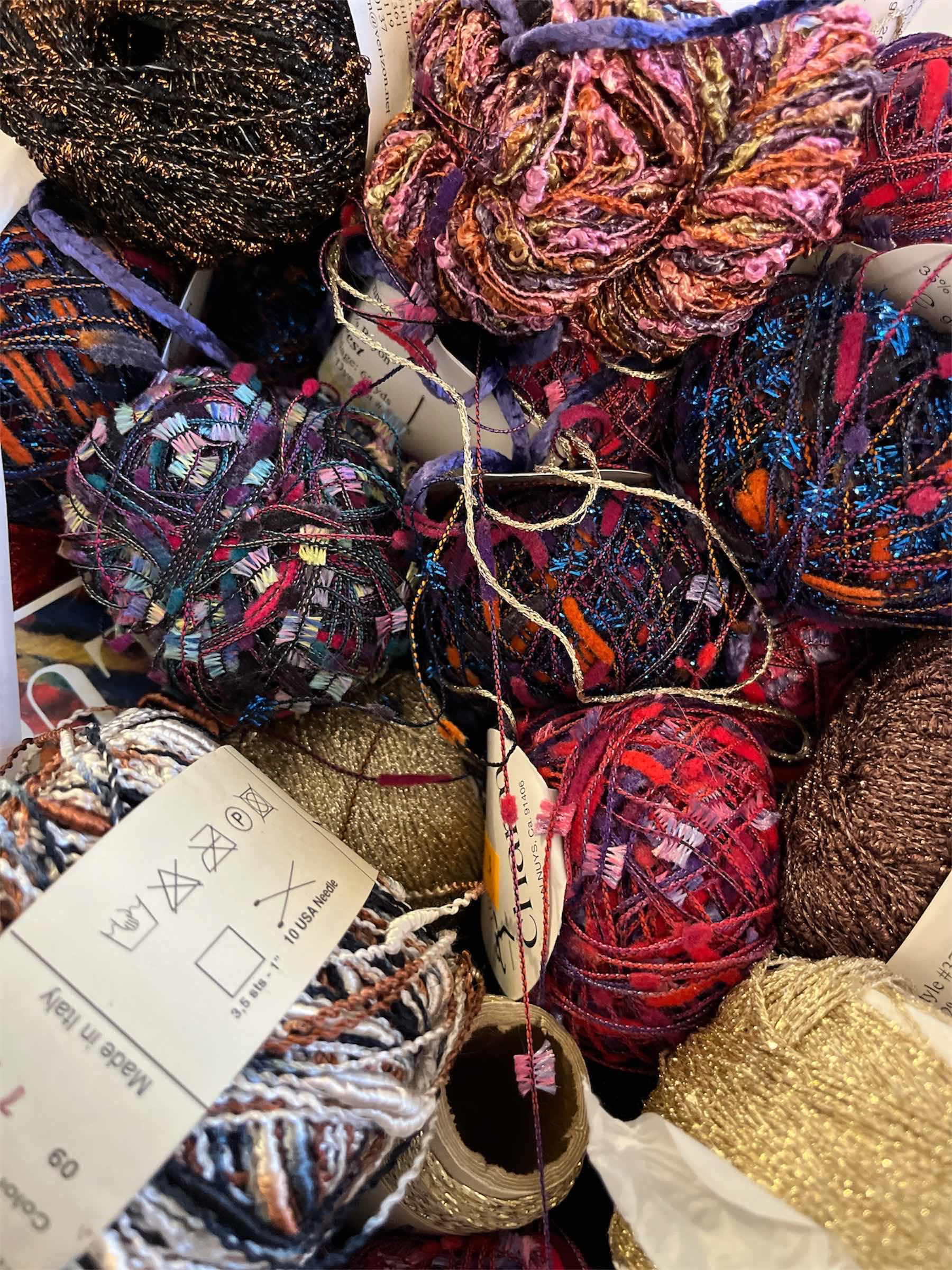 Photo 1 of CONTAINER AND BAG OF ASSORTED COLORFUL CRAFTING MATERIALS TINSEL AND KNITTING YARN