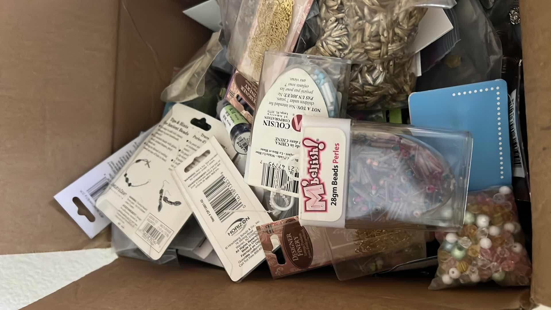 Photo 1 of BOX OF ASSORTED CRAFT AND JEWELRY BEADS AND FINDINGS