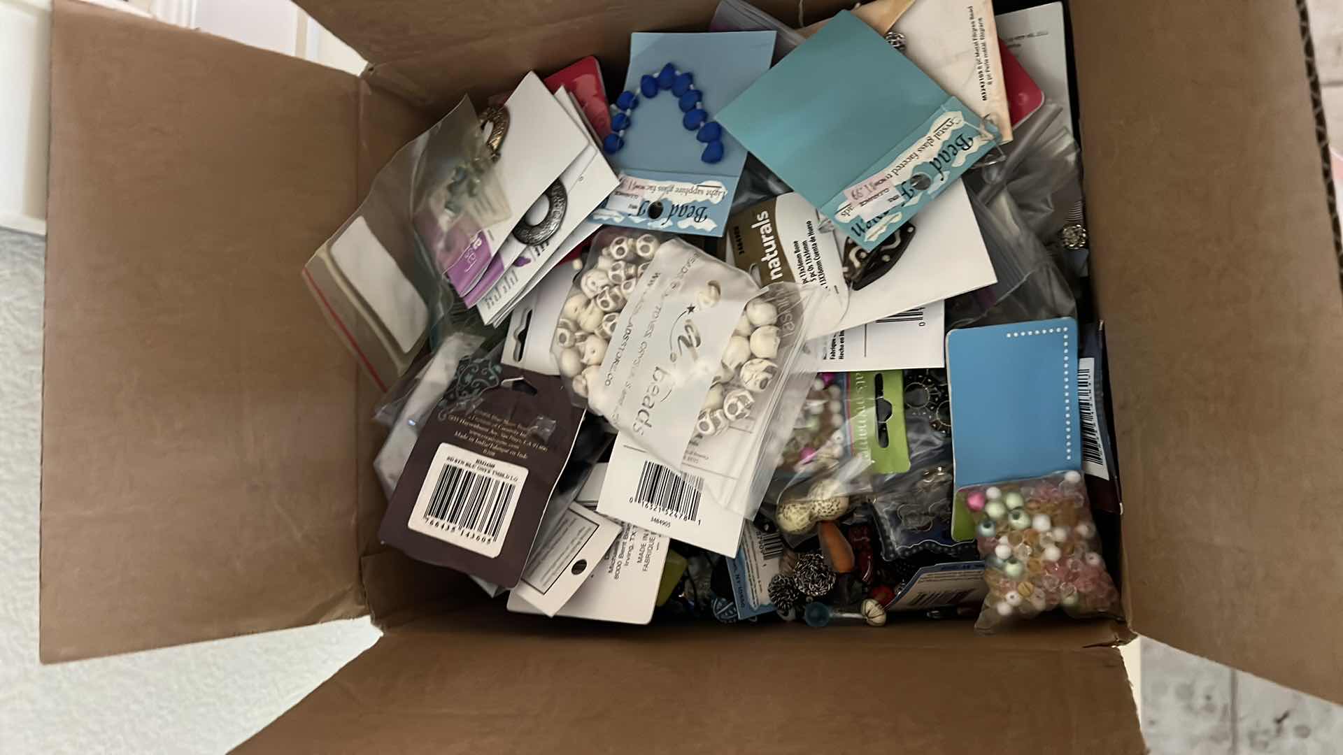 Photo 1 of BOX OF ASSORTED CRAFT AND JEWELRY BEADS AND FINDINGS
