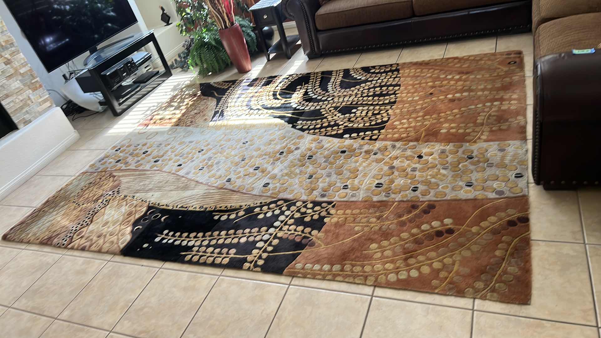 Photo 2 of EARTH-TONE PATTERN AREA RUG 93" x 134"